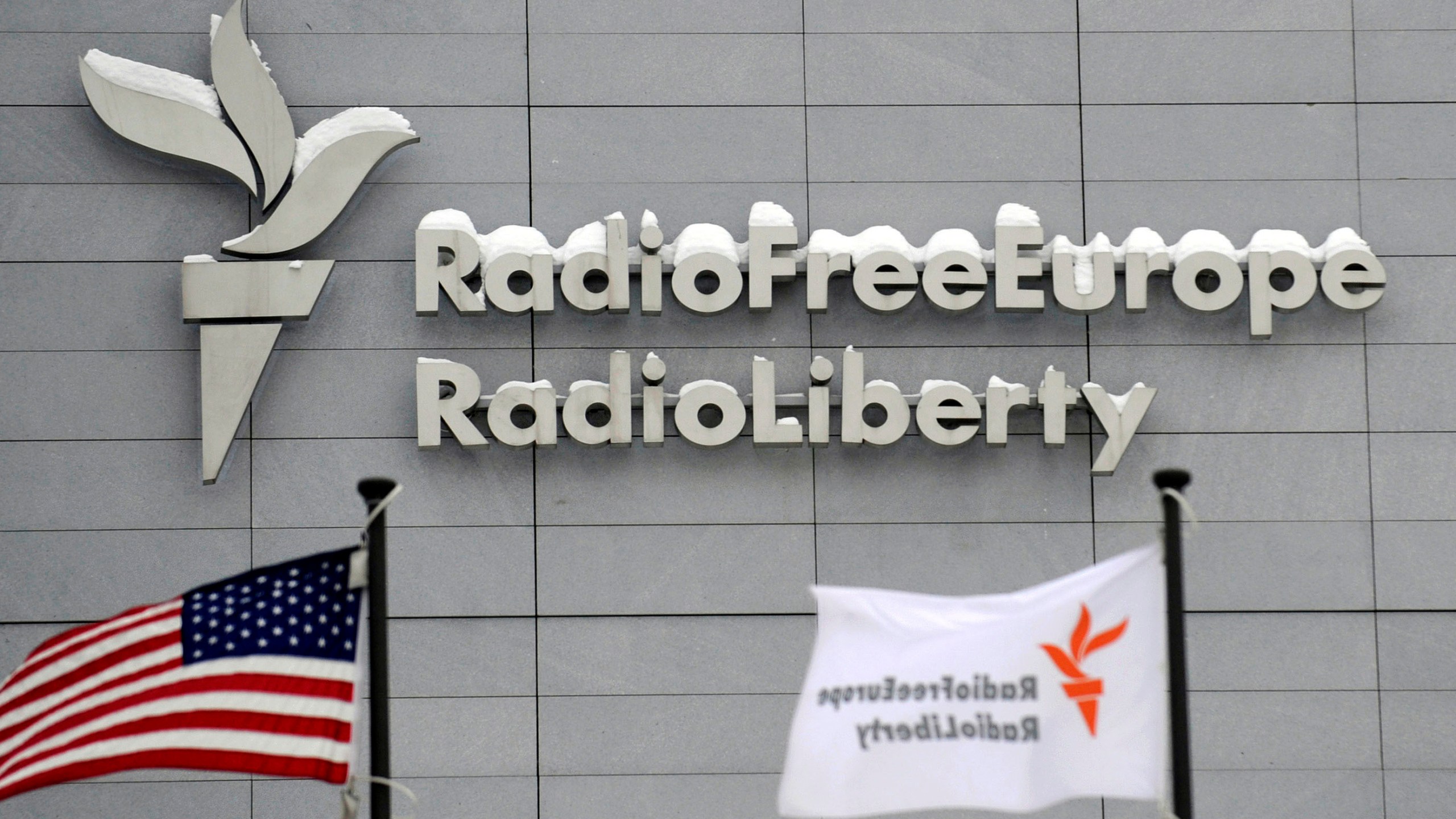 FILE - The headquarters of Radio Free Europe/Radio Liberty (RFE/RL) is seen with the American flag in the foreground, in Prague, Jan. 15, 2010. (Michal Kamaryt/CTK via AP, file)
