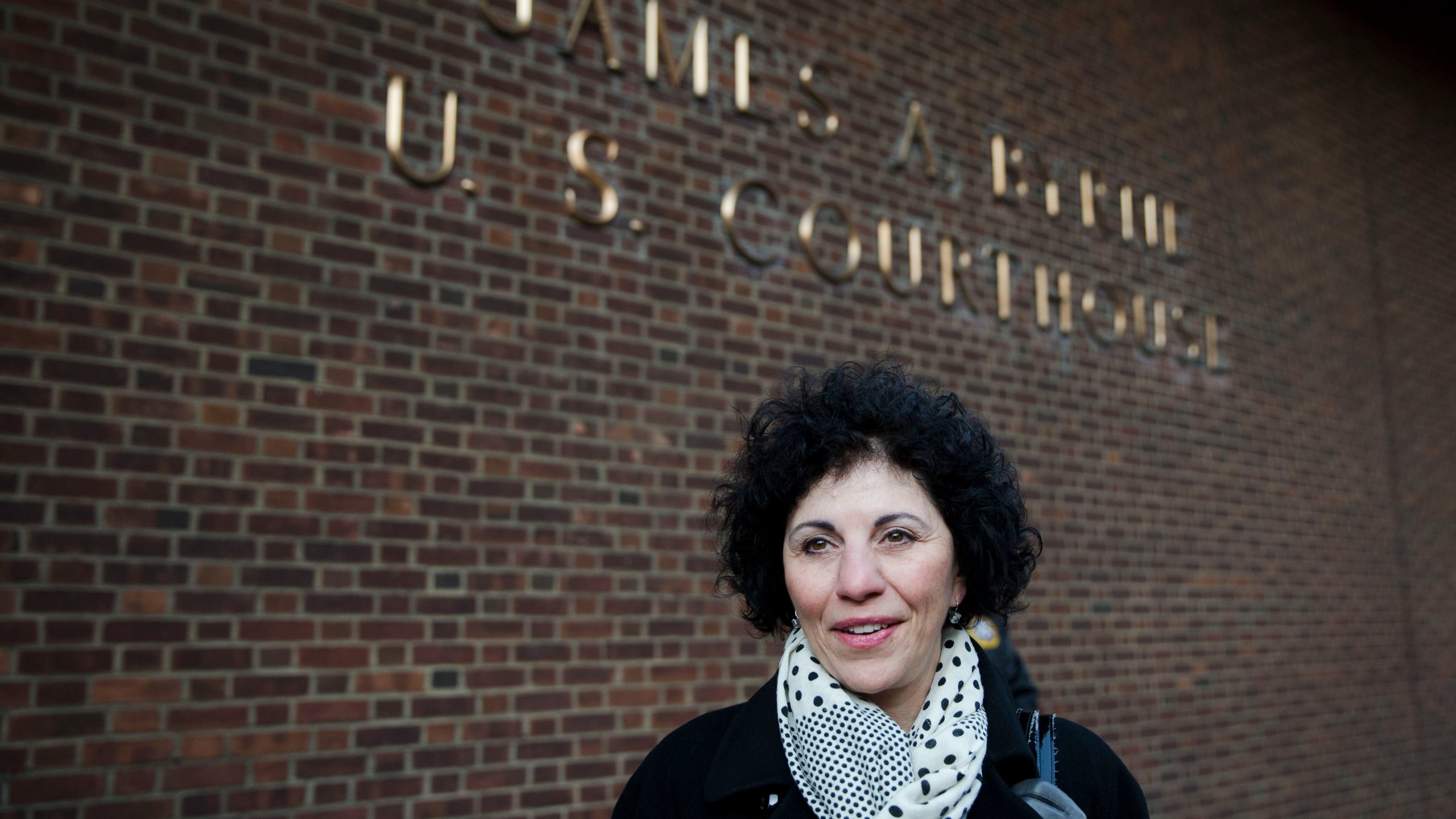 FILE - Eleanor Perfetto widow of NFL player Ralph Wenzel leaves the U.S. Courthouse after a hearing on the proposed NFL concussion settlement Wednesday, Nov. 19, 2014, in Philadelphia. (AP Photo/Matt Rourke, file)