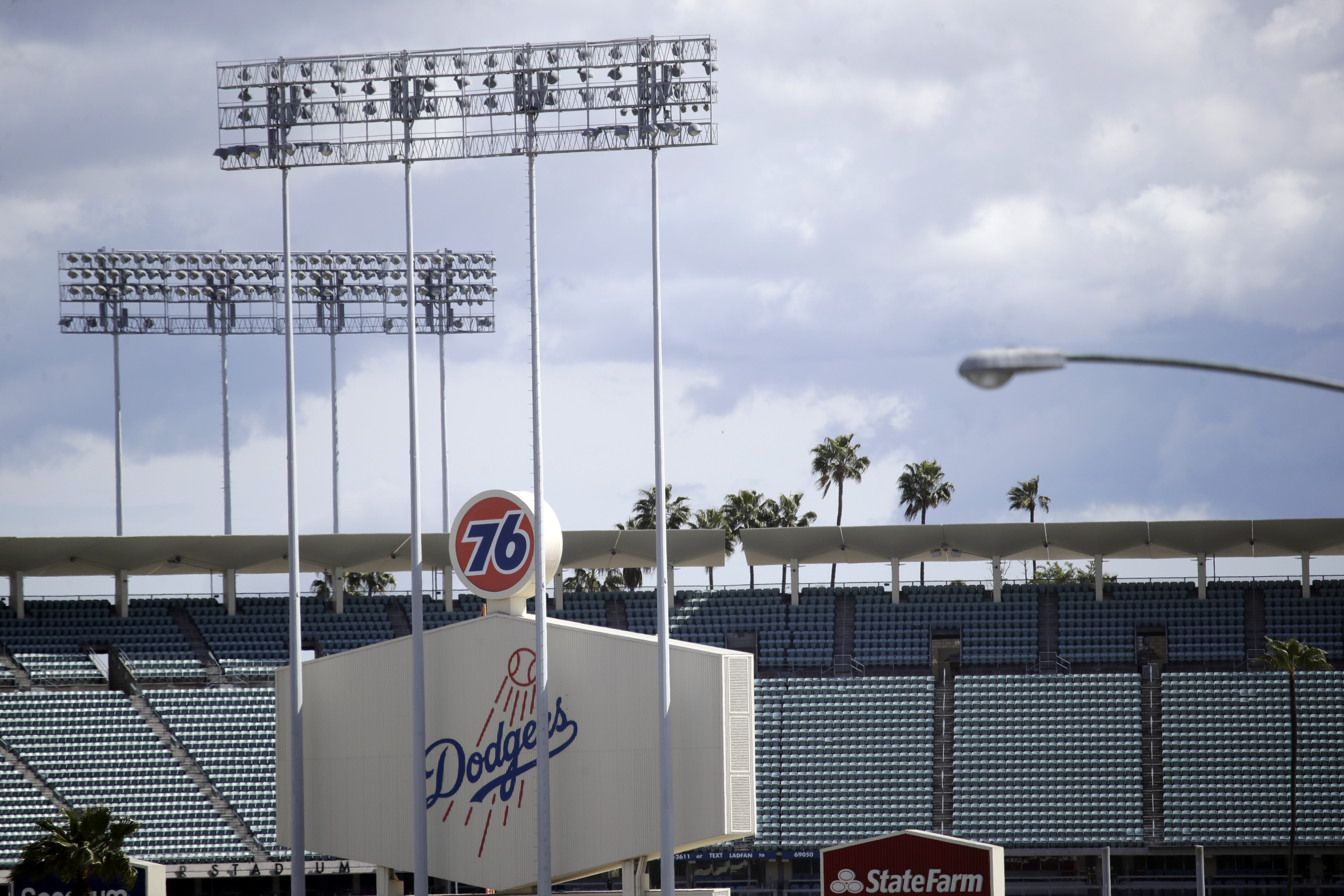 FILE - The exterior of Dodgers Stadium, home of the Los Angeles Dodgers is seen in Los Angeles on March 25, 2020. (AP Photo/Marcio Jose Sanchez, File)