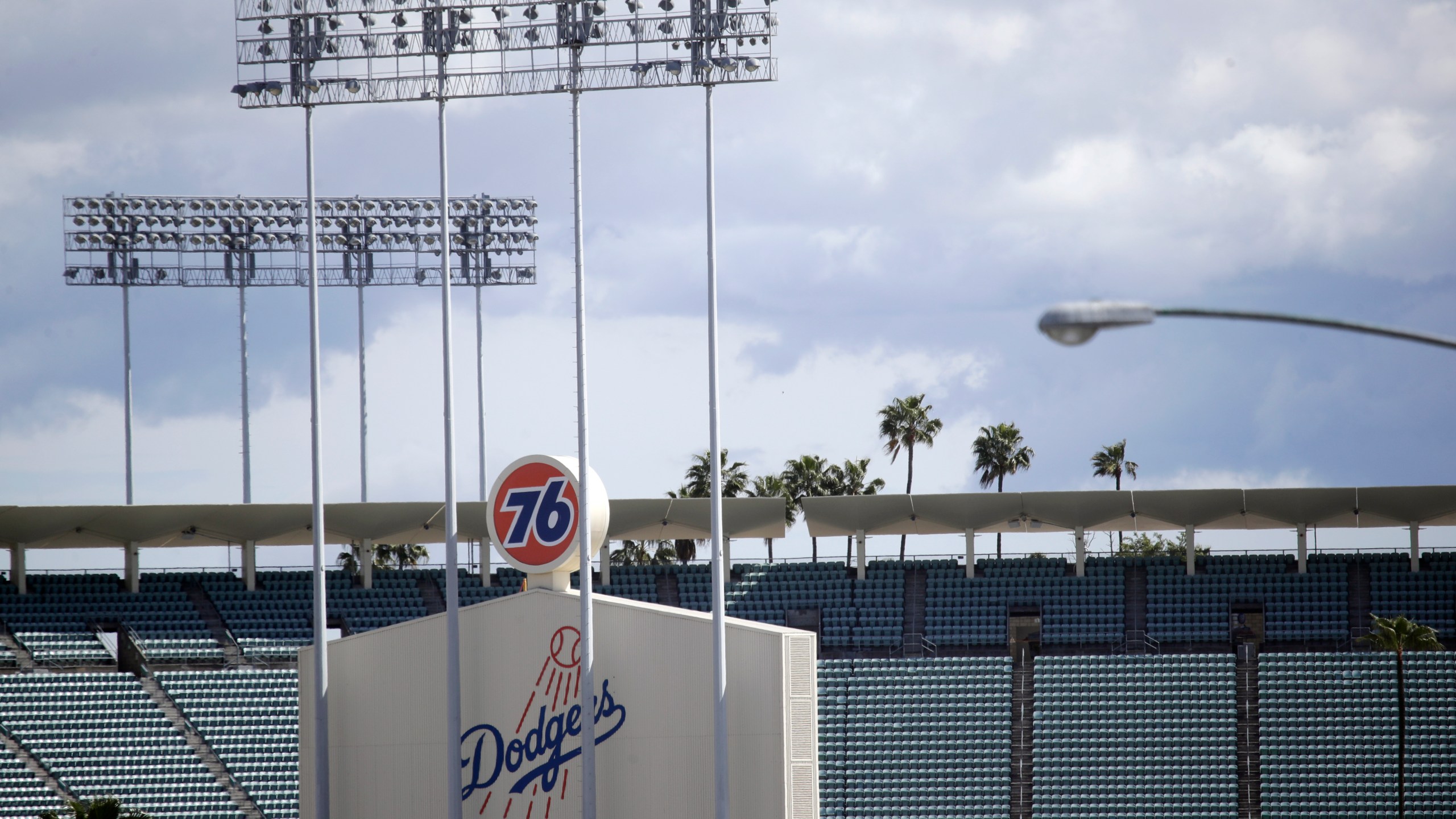 FILE - The exterior of Dodgers Stadium, home of the Los Angeles Dodgers is seen in Los Angeles on March 25, 2020. (AP Photo/Marcio Jose Sanchez, File)