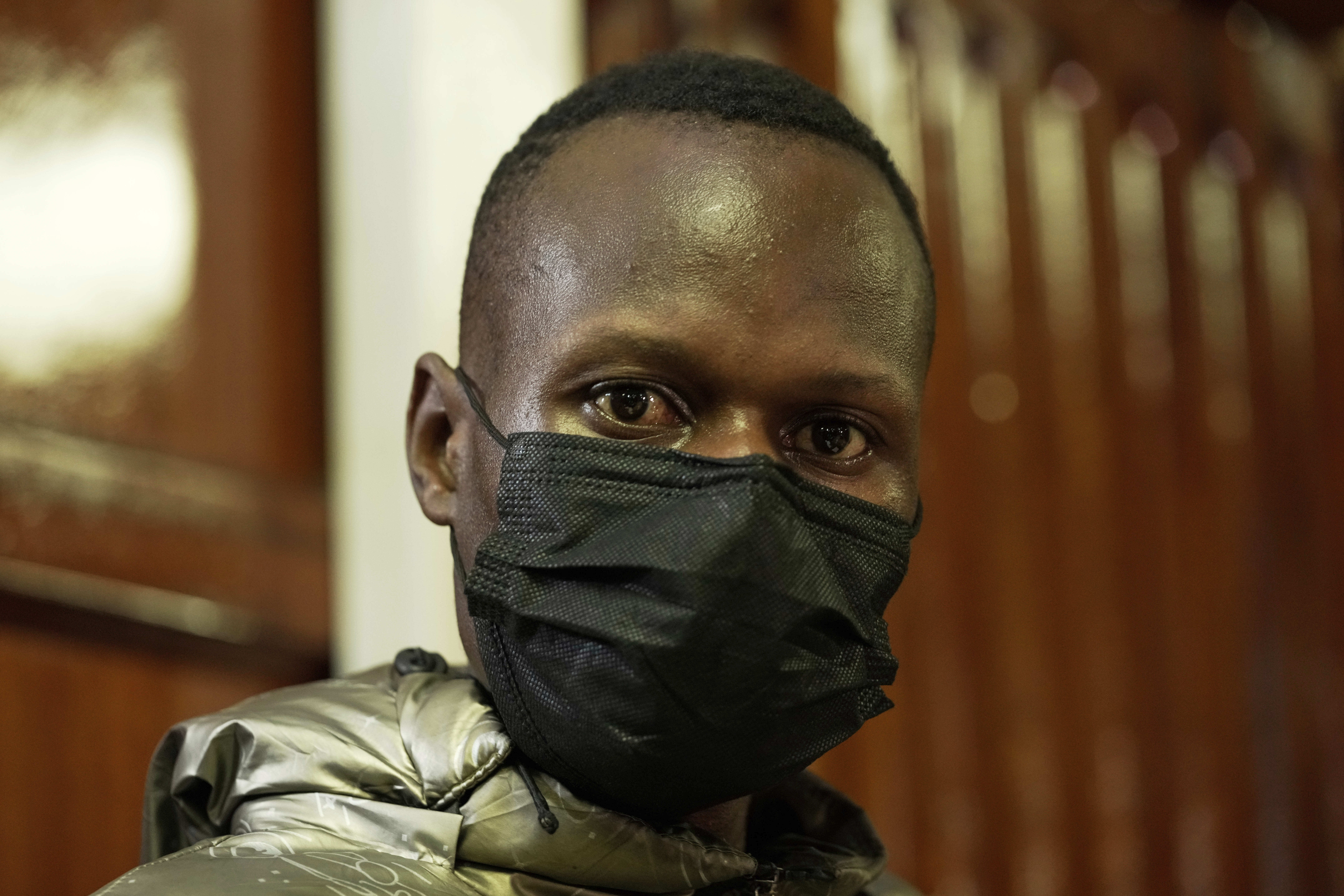 CORRECTS NAME TO KLINZY BARASA - Kenyan police officer Klinzy Barasa, accused of assaulting and shooting hawker Boniface Kariuki during a protest, appears at the Milimani Law Courts in Nairobi, Kenya, Thursday, June 19, 2025. (AP Photo/Brian Inganga)