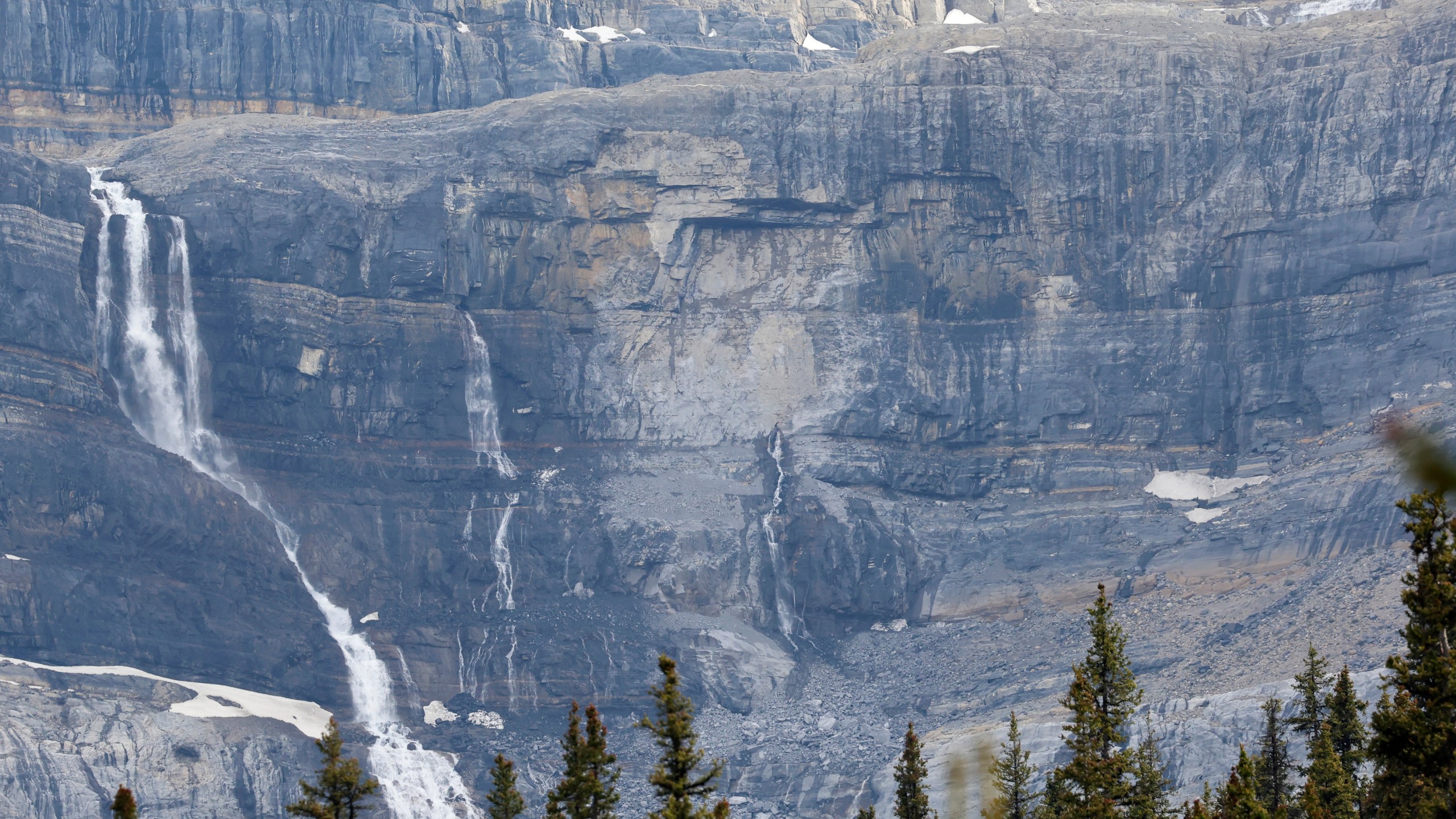 A rock slide, center, is seen near Bow Glacier Falls, north of Lake Louise, Alta. in Banff National Park on Thursday, June 19, 2025. (Larry MacDougal/The Canadian Press via AP)