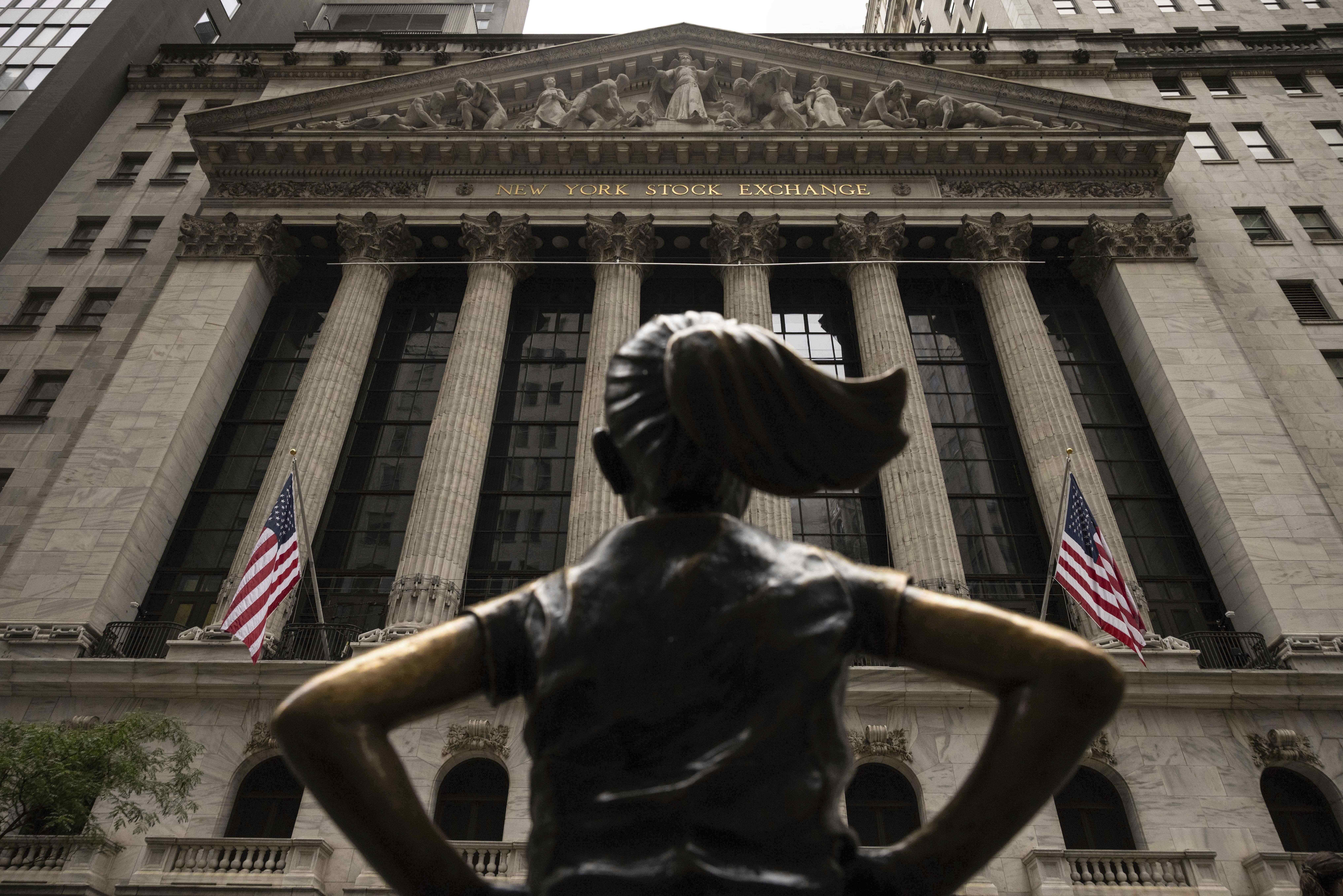 The "Fearless Girl" statue stands in front of the New York Stock Exchange, Wednesday, June 18, 2025, in New York. (AP Photo/Yuki Iwamura)
