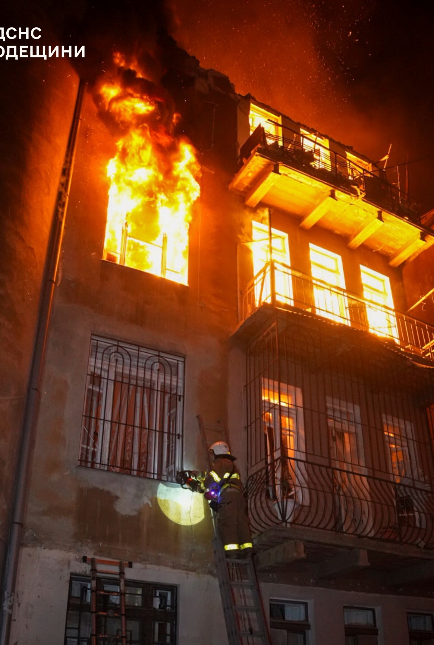 In this photo provided by the Ukrainian Emergency Service, firefighters put out the fire in an apartment building following Russia's massive air attack in Odesa, Ukraine, Friday, June 20, 2025. (Ukrainian Emergency Service via AP)
