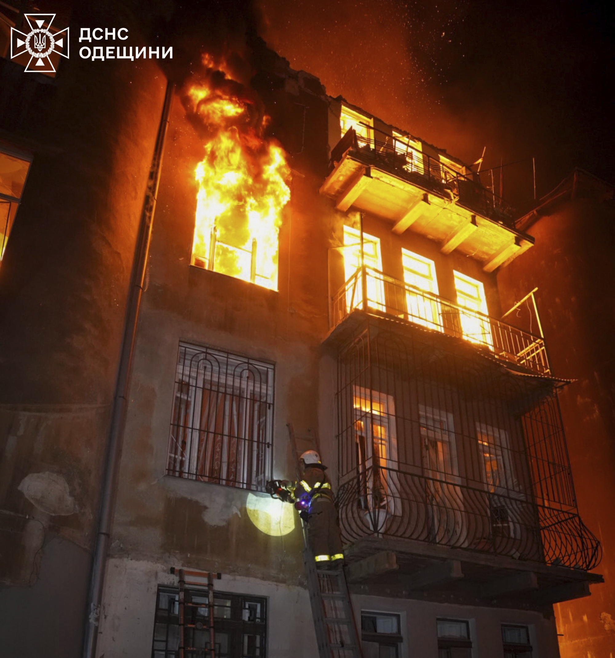 In this photo provided by the Ukrainian Emergency Service, firefighters put out the fire in an apartment building following Russia's massive air attack in Odesa, Ukraine, Friday, June 20, 2025. (Ukrainian Emergency Service via AP)
