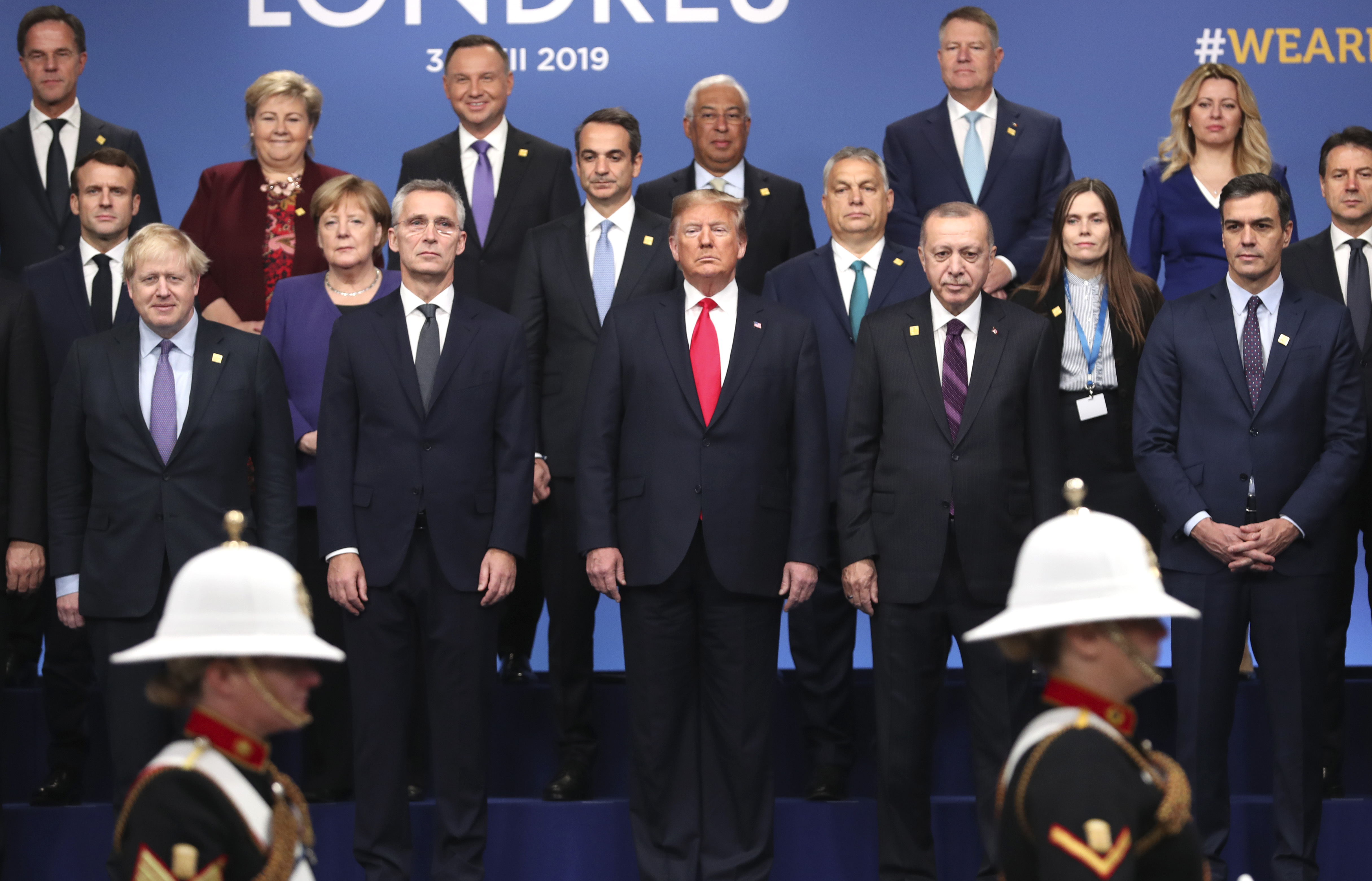 FILE - In this Dec. 4, 2019, photo, from front row left, British Prime Minister Boris Johnson, NATO Secretary General Jens Stoltenberg, U.S. President Donald Trump, Turkish President Recep Tayyip Erdogan and Spanish Prime Minister Pedro Sanchez attend a ceremony event during a NATO leaders meeting at The Grove hotel and resort in Watford, Hertfordshire, England. (AP Photo/Francisco Seco, File)