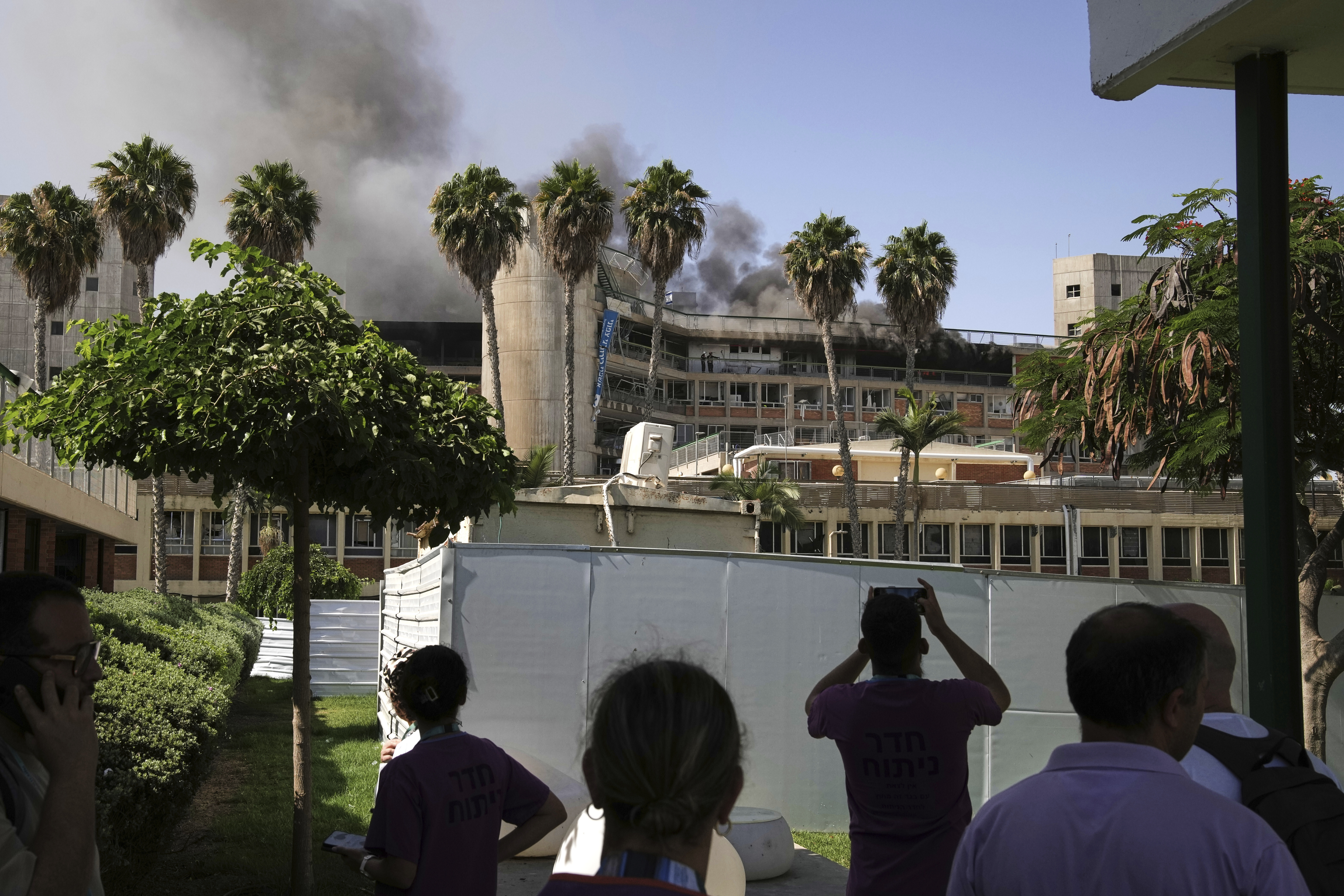 Smokes rises from a building of the Soroka hospital complex after it was hit by a missile fired from Iran in Beersheba, Israel, Thursday, June 19, 2025. (AP Photo/Leo Correa)