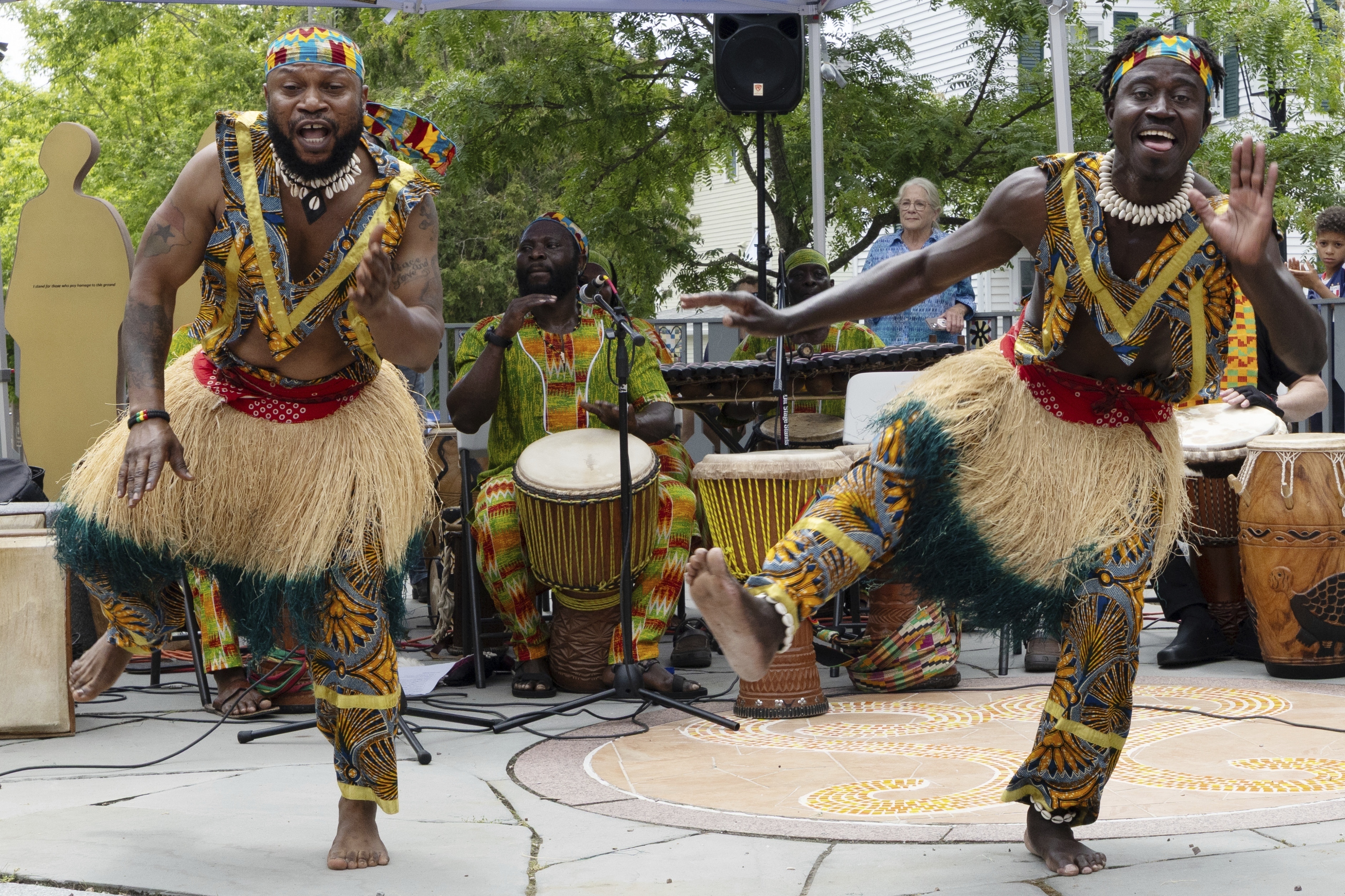 Members of the Akwaaba Ensemble Nii Osenda, left, and Samuel Marquaye dance during a Juneteenth celebration at the African Burying Ground Memorial Park Thursday, June 19, 2025, in Portsmouth, N.H. (AP Photo/Michael Dwyer)
