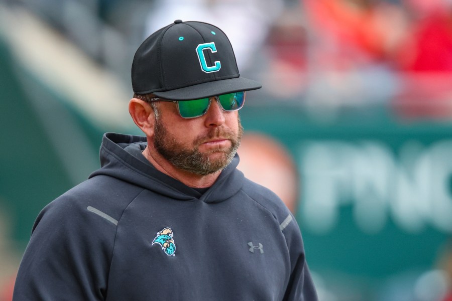FILE - Coastal Carolina head coach Kevin Schnall walks onto the field during an NCAA baseball game against Ohio State in Jacksonville, Fla., Feb. 22, 2025. (AP Photo/Gary McCullough, file)