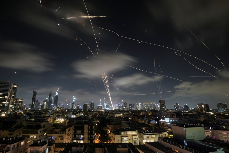 The Israeli Iron Dome air defense system fires to intercept missiles during an Iranian attack over Tel Aviv, Israel, early Wednesday, June 18, 2025. (AP Photo/Leo Correa)