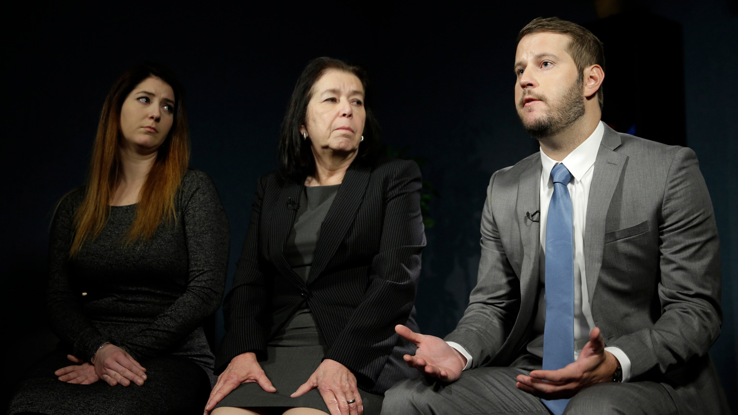 FILE - Christine Levinson, center, wife of Robert Levinson, and her children, Dan Levinson, right, and Samantha Levinson talk to reporters in New York, Jan. 18, 2016. (AP Photo/Seth Wenig, File)