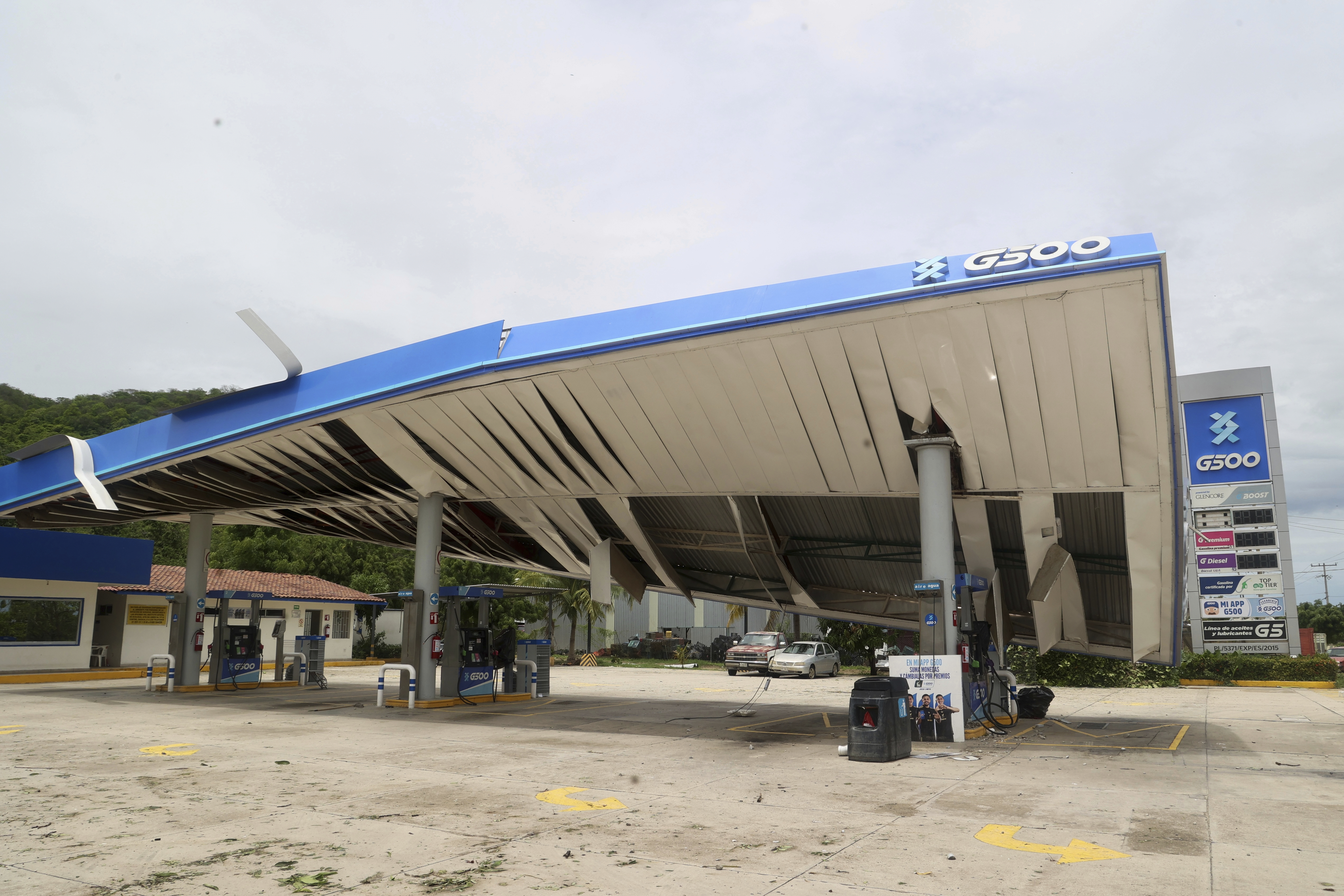 A gas station is damaged after Hurricane Erick hit near San Jose del Progreso, Oaxaca state, Mexico, Thursday, June 19, 2025. (AP Photo/Luis Alberto Cruz)