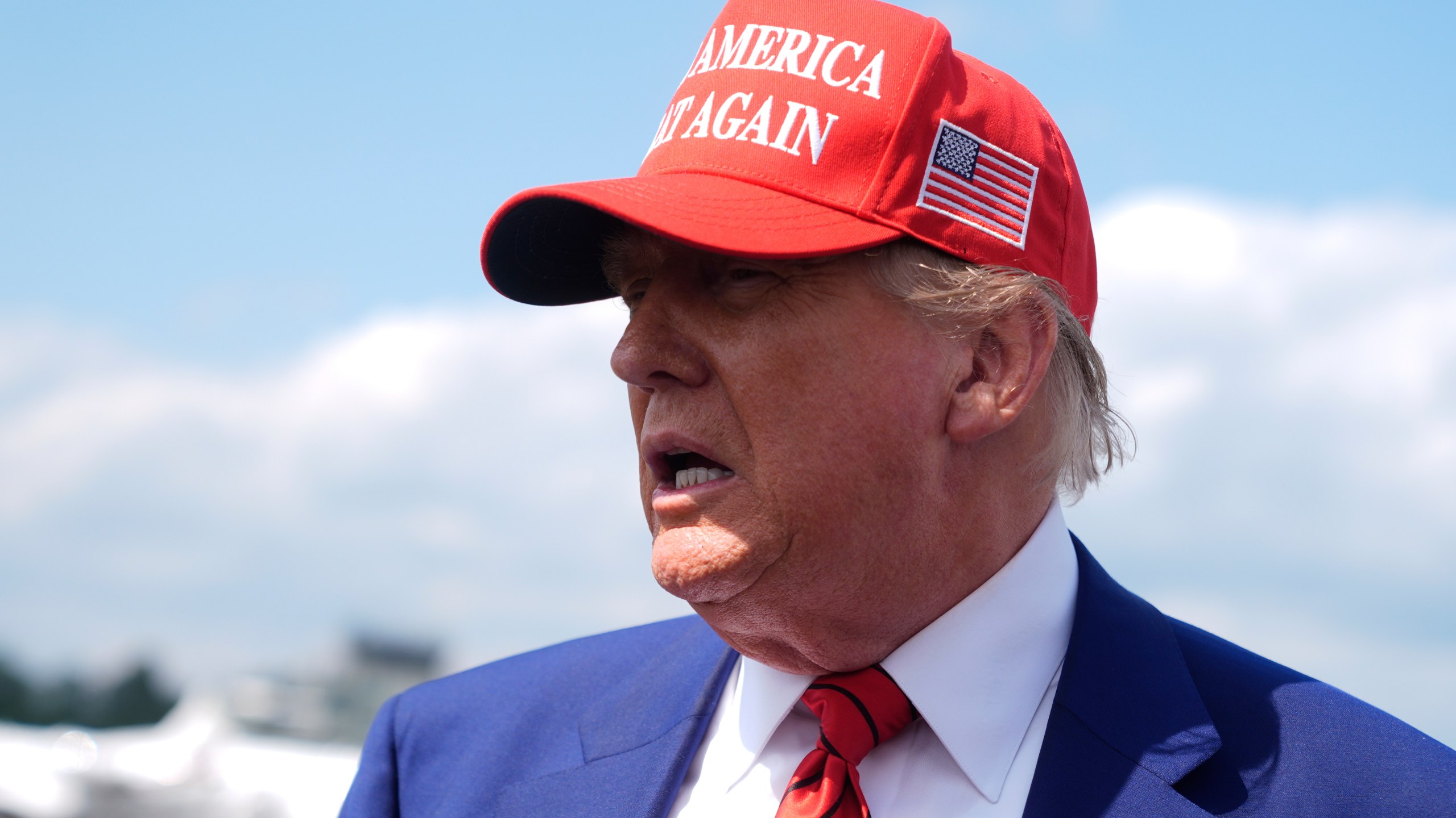 President Donald Trump speaks with reporters upon arriving at Morristown Municipal Airport in Morristown, N.J., Friday, June 20, 2025. (AP Photo/Manuel Balce Ceneta)