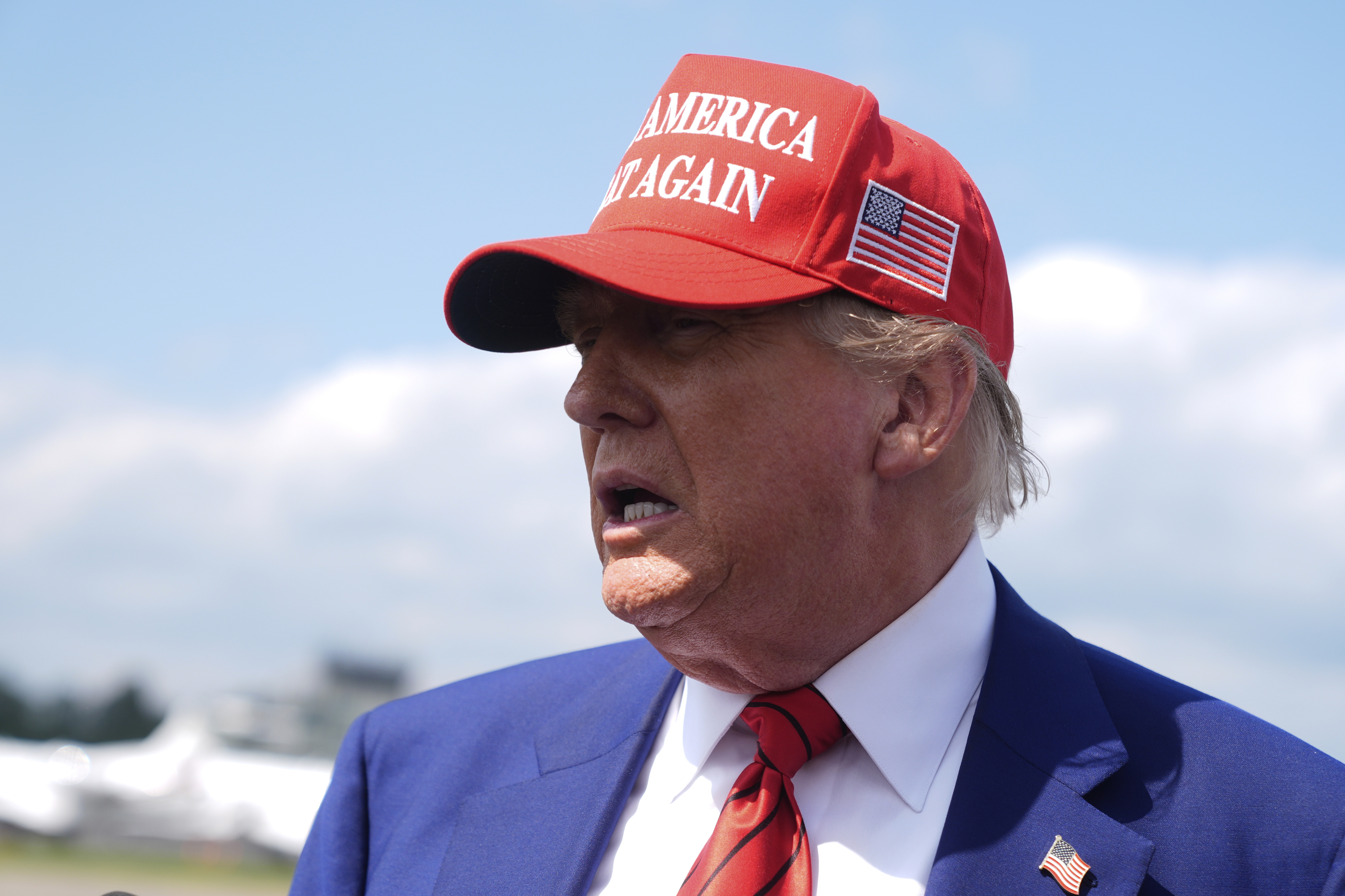 President Donald Trump speaks with reporters upon arriving at Morristown Municipal Airport in Morristown, N.J., Friday, June 20, 2025. (AP Photo/Manuel Balce Ceneta)