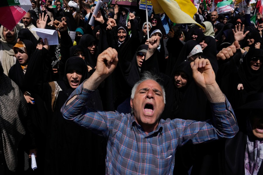 People chant slogans during a protest to condemn Israeli attacks on multiple cities across Iran, after the Friday prayers ceremony in Tehran, Iran, Friday, June 20, 2025. (AP Photo/Vahid Salemi)