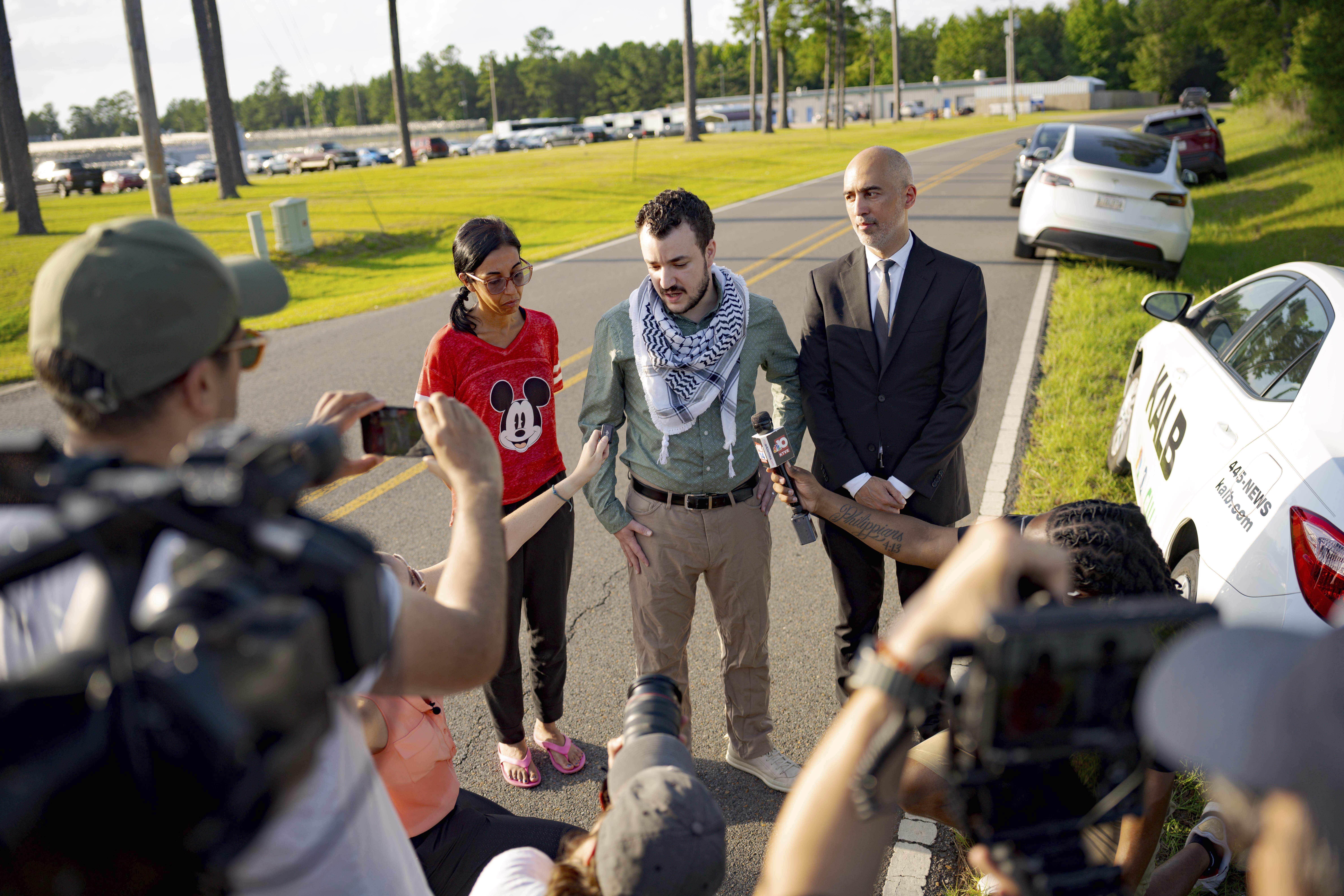 Palestinian activist Mahmoud Khalil, center, speaks after his release from federal immigration detention in Jena, La., Friday, June 20, 2025. (AP Photo/Matthew Hinton)