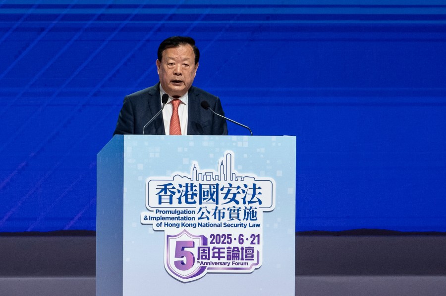 Xia Baolong, director of Hong Kong & Macao Affairs Office, speaks at the 5th anniversary of Hong Kong National Security Law Forum in Hong Kong, Saturday, June 21, 2025. (AP Photo/Chan Long Hei)
