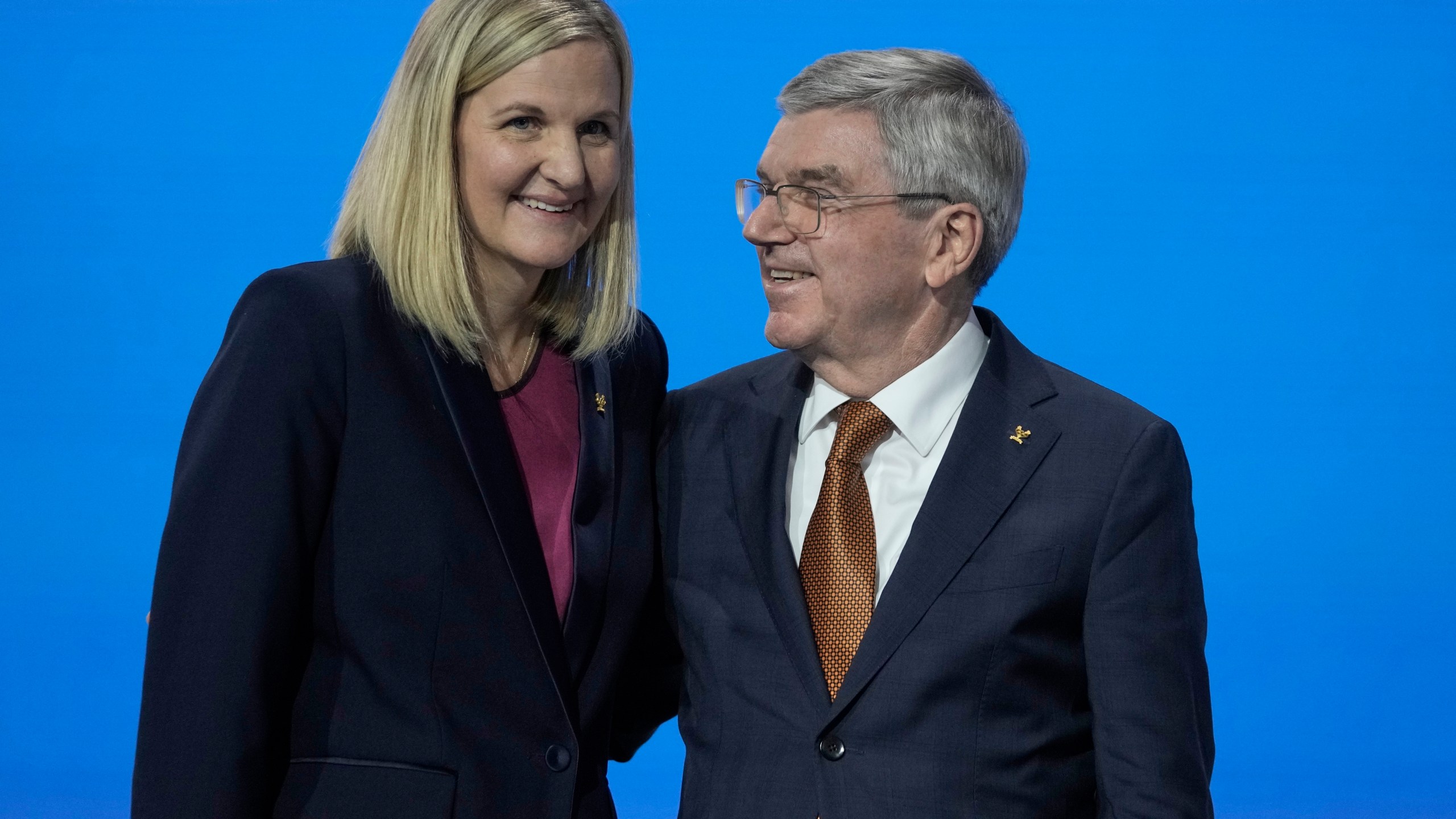 FILE - IOC President Thomas Bach, right, greets Kirsty Coventry after she was announced as the new IOC President at the International Olympic Committee 144th session in Costa Navarino, western Greece, Thursday, March 20, 2025. (AP Photo/Thanassis Stavrakis, File)