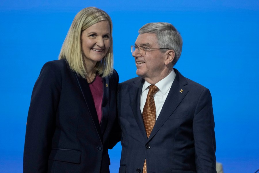 FILE - IOC President Thomas Bach, right, greets Kirsty Coventry after she was announced as the new IOC President at the International Olympic Committee 144th session in Costa Navarino, western Greece, Thursday, March 20, 2025. (AP Photo/Thanassis Stavrakis, File)