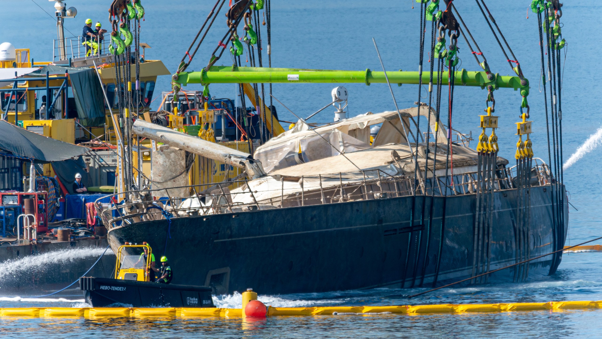 The hull of the superyacht Bayesian, which sank near Palermo, Sicily, on August 19, 2024, is pulled out of the sea and dewatered off the village of Porticello Saturday, June 21, 2025. (AP Photo/Salvatore Cavalli)