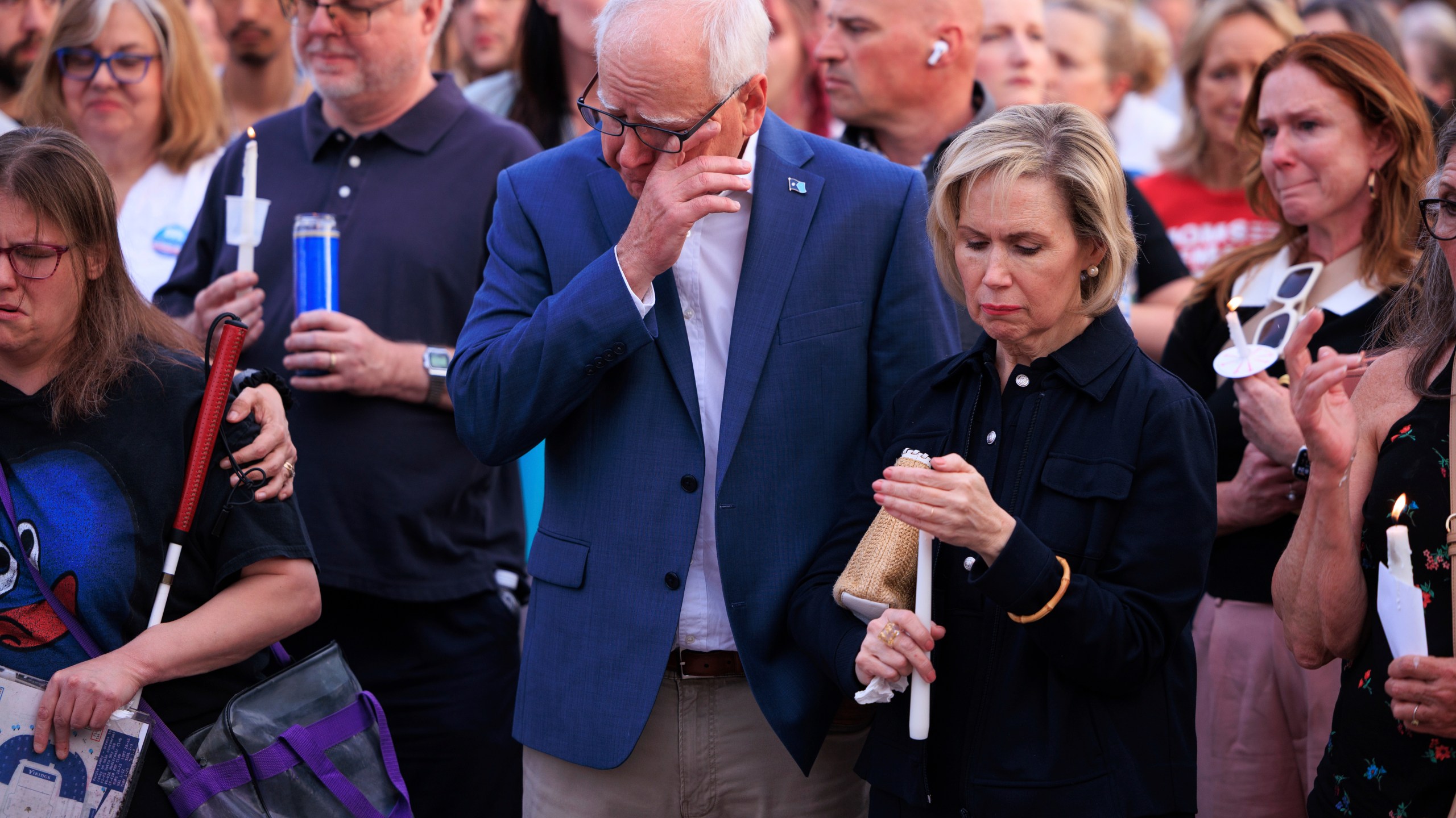 Minnesota Gov. Tim Walz and his wife Gwen Walz attend a candlelight vigil for former House Speaker Melissa Hortman and her husband Mark, who were fatally shot, at the state Capitol, Wednesday, June 18, 2025, in St. Paul, Minn. (AP Photo/Nikolas Liepins)