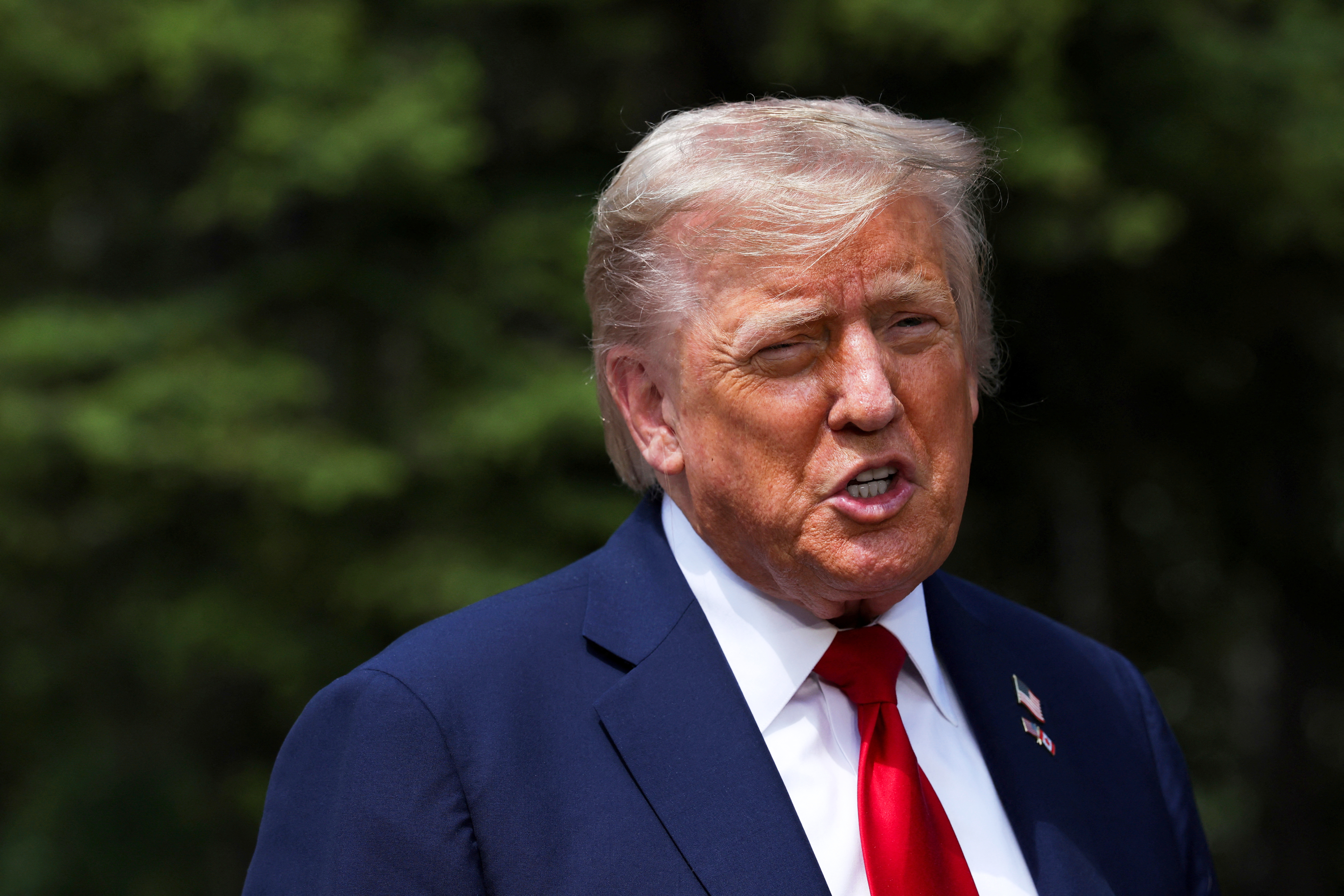 U.S. President Donald Trump speaks to the media during a meeting with Britain's Prime Minister Keir Starmer, at the G7 summit, in Kananaskis, Alberta, Monday, June 16, 2025. (Suzanne Plunkett/Pool Photo via AP)