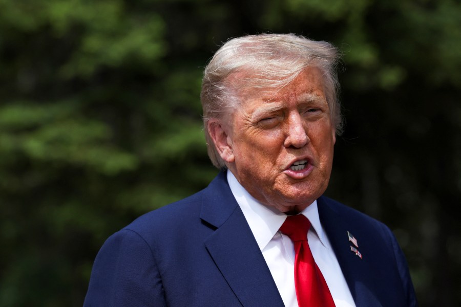 U.S. President Donald Trump speaks to the media during a meeting with Britain's Prime Minister Keir Starmer, at the G7 summit, in Kananaskis, Alberta, Monday, June 16, 2025. (Suzanne Plunkett/Pool Photo via AP)