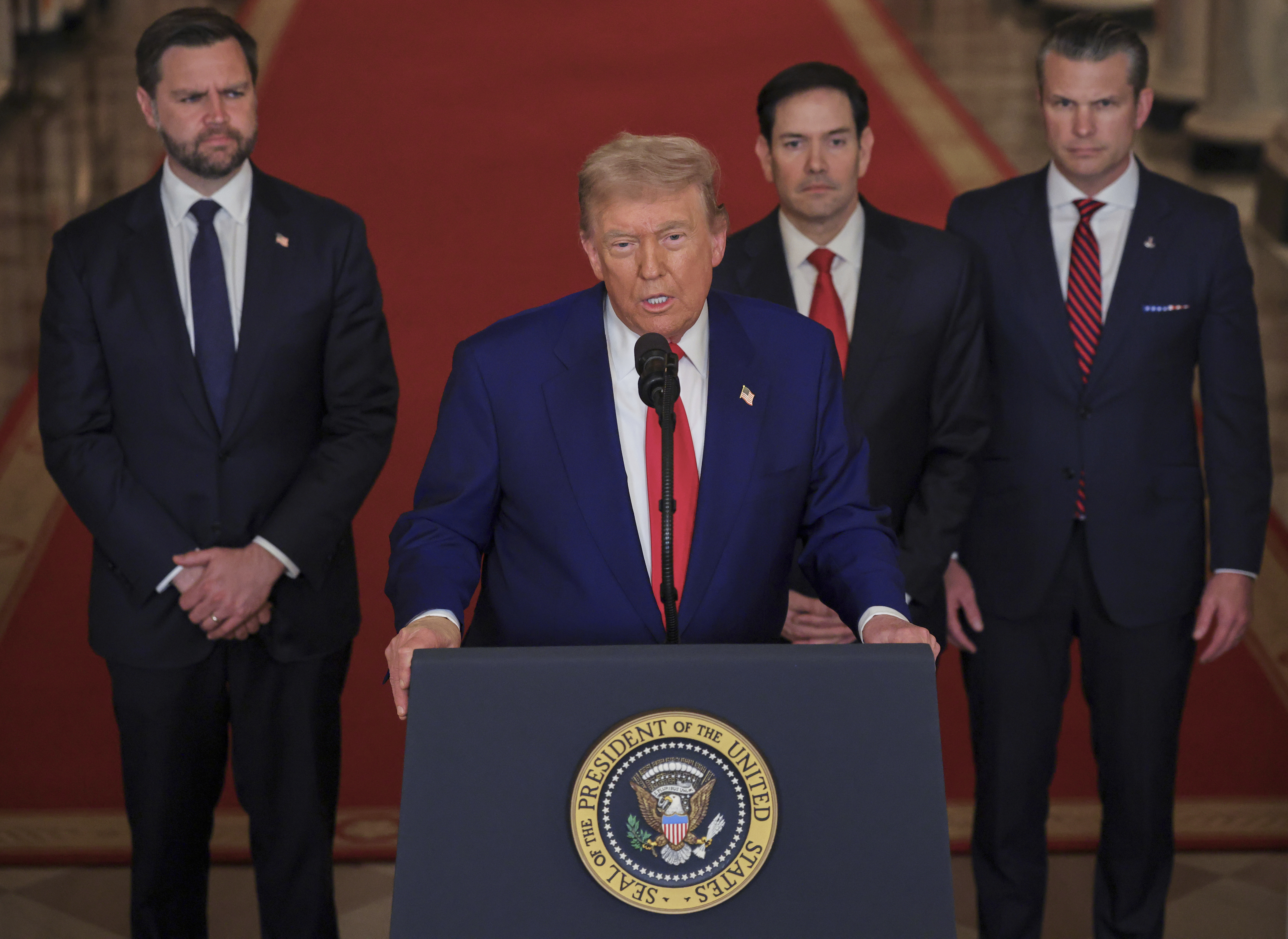 President Donald Trump speaks from the East Room of the White House in Washington, Saturday, June 21, 2025, after the U.S. military struck three Iranian nuclear and military sites, directly joining Israel's effort to decapitate the country's nuclear program, as Vice President JD Vance, Secretary of State Marco Rubio and Defense Secretary Pete Hegseth listen. (Carlos Barria/Pool via AP)