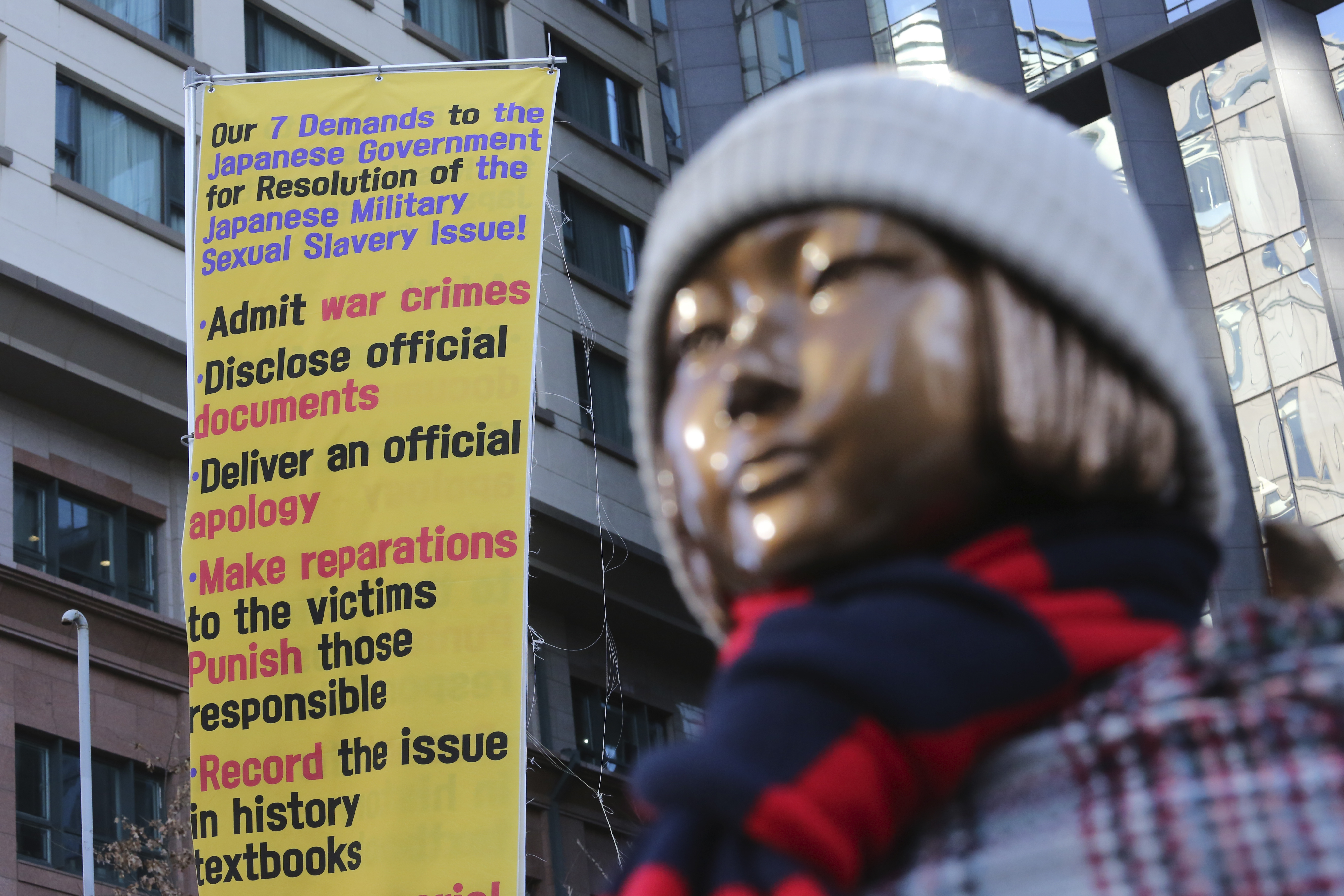 FILE - A statue symbolizing a wartime sex slave is displayed near the Japanese Embassy in Seoul, South Korea, on Jan. 8, 2021. (AP Photo/Ahn Young-joon, File)