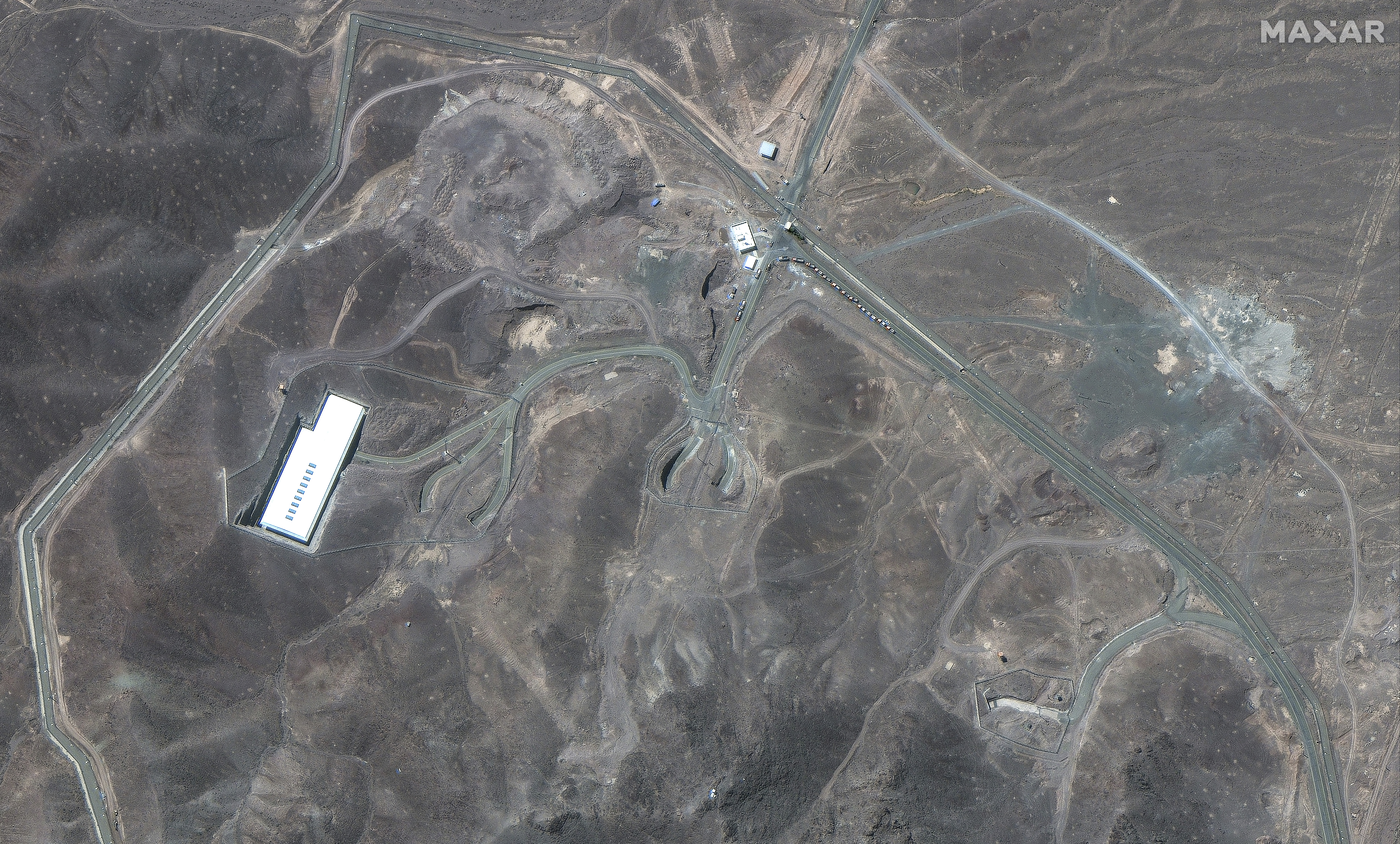 This satellite image provided by Maxar Technologies shows vehicles at Fordo enrichment facility in Iran on Thursday, June 19, 2025. (Maxar Technologies via AP)