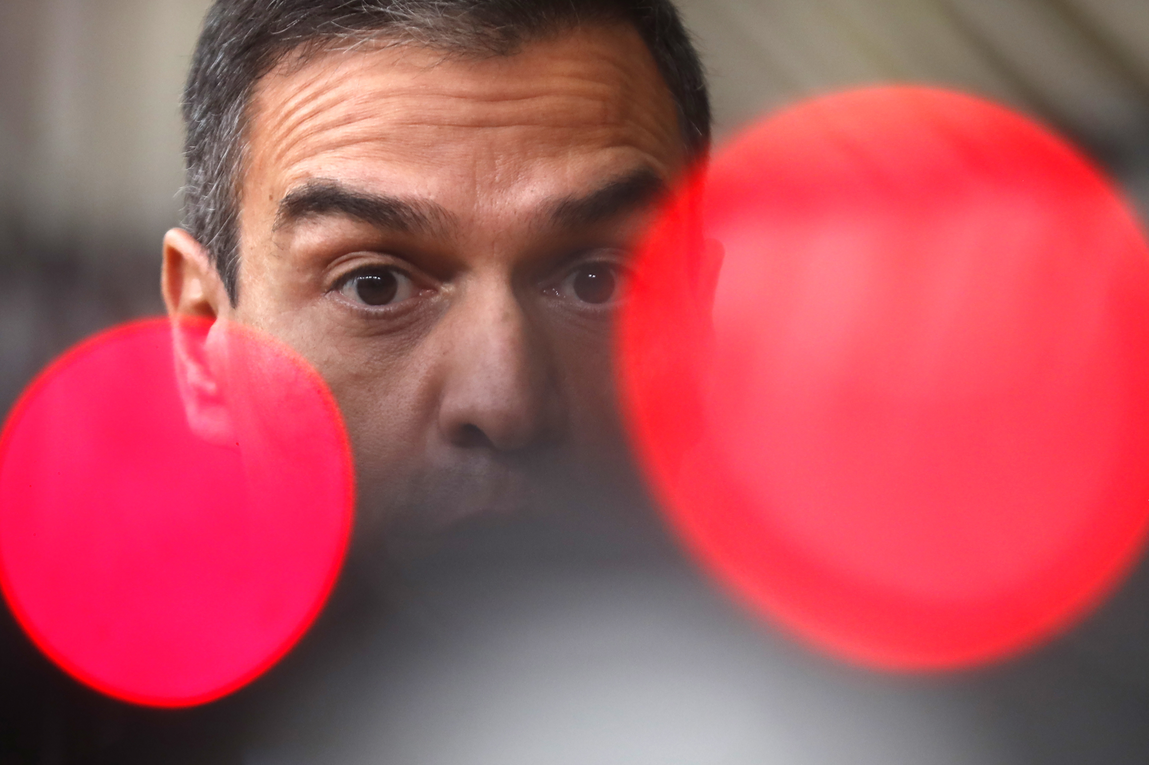FILE- Spain's Prime Minister Pedro Sanchez speaks on camera as he arrives for an EU summit at the European Council building in Brussels, Oct. 1, 2020. (AP Photo/Francisco Seco, File)