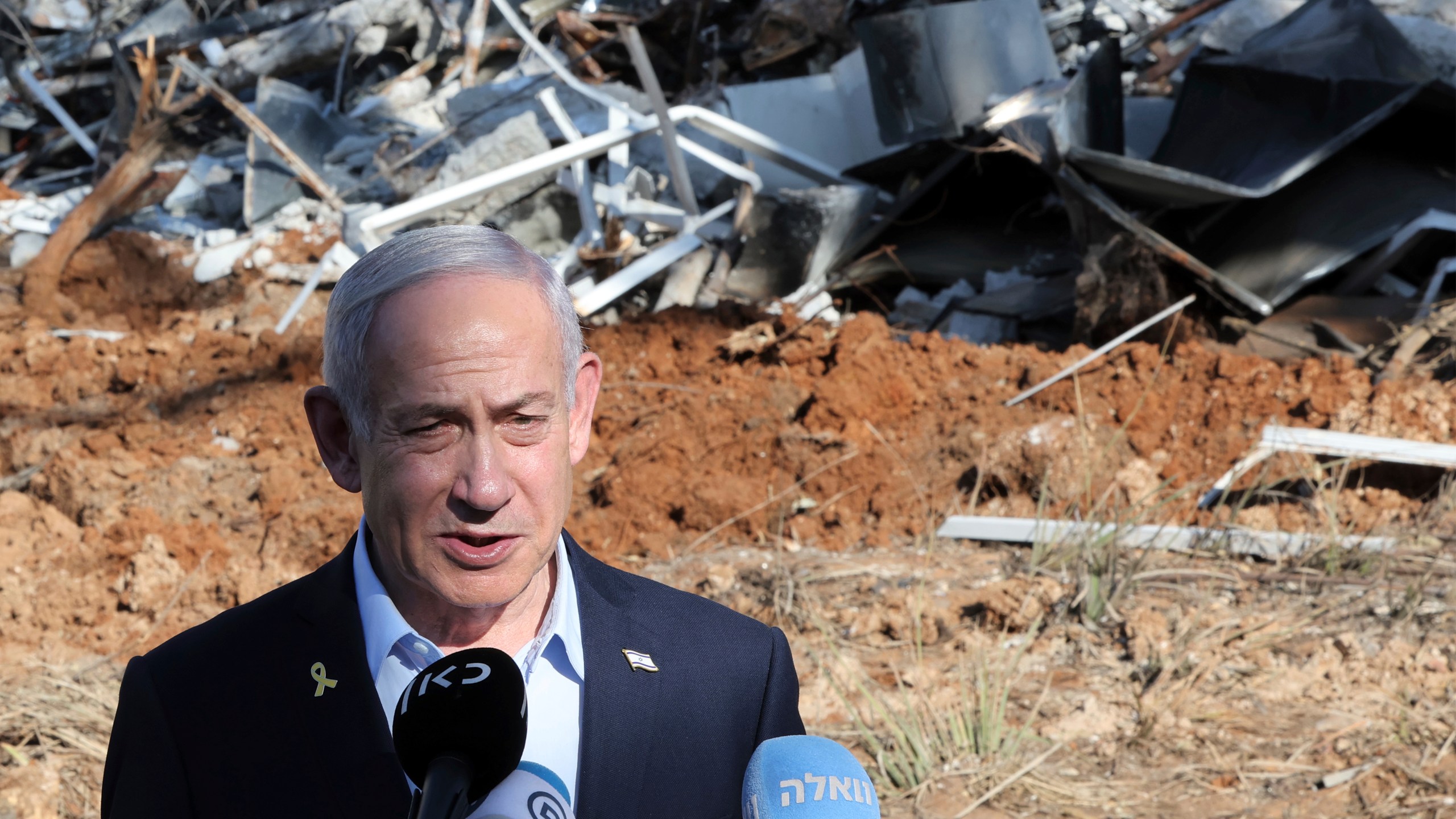 Israel's Prime Minister Benjamin Netanyahu gives a statement during a visit to the site of the Weizmann Institute of Science, which was hit by missiles fired from Iran, in the central city of Rehovot on Friday, June 20, 2025. (Jack Guez/Pool Photo via AP)