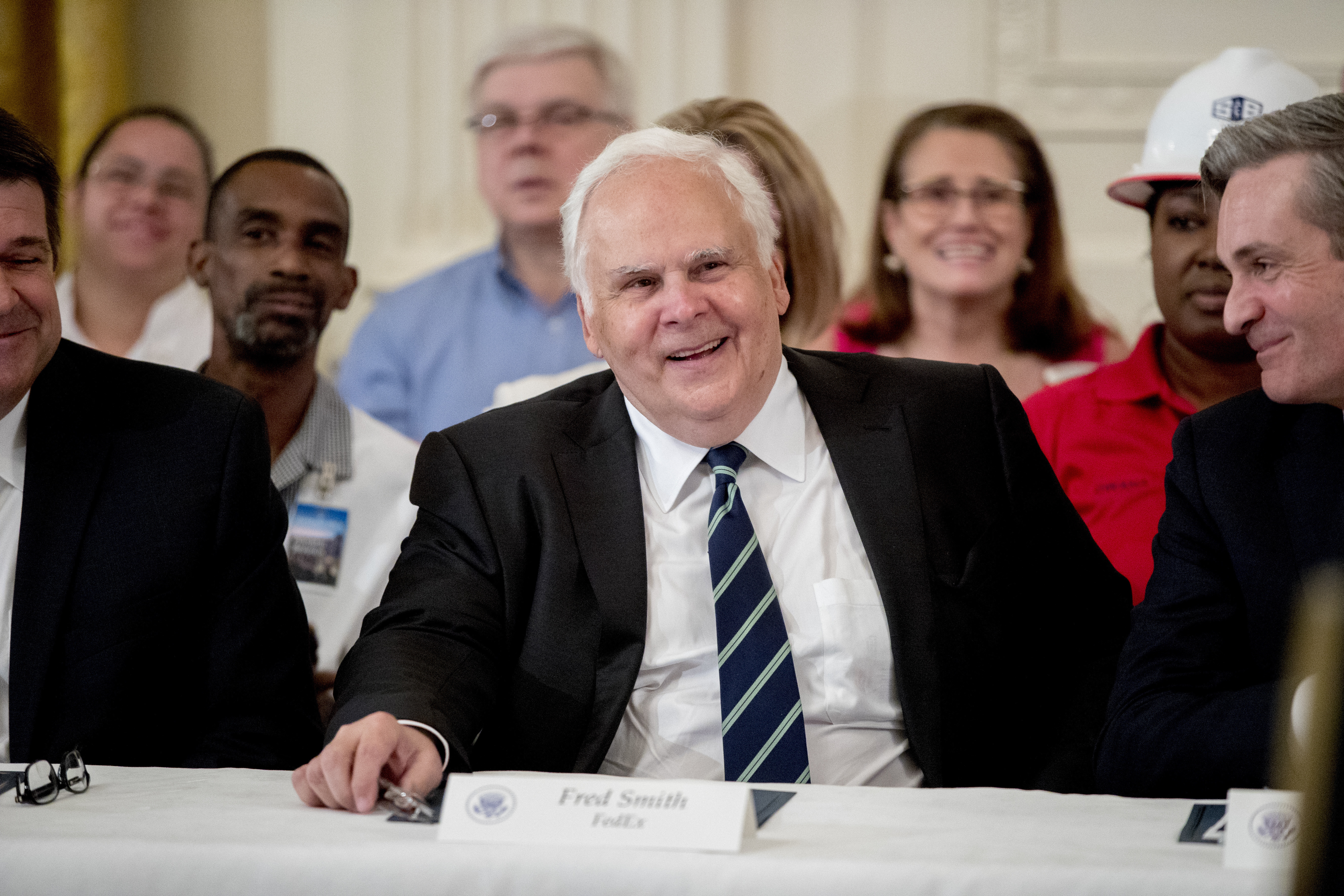 FILE - FedEx CEO Fred Smith appears at a signing ceremony where President Donald Trump signed an Executive Order that establishes a National Council for the American Worker in the East Room of the White House, Thursday, July 19, 2018, in Washington. (AP Photo/Andrew Harnik, File)