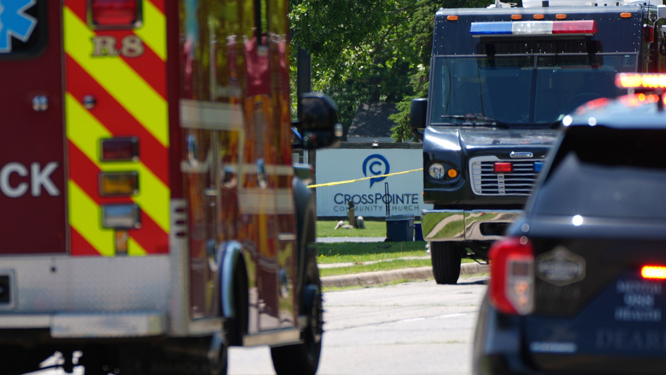 Emergency vehicles gather near CrossPointe Community Church in Wayne, Mich., Sunday, June 23, 2025. (AP Photo/Paul Sancya)