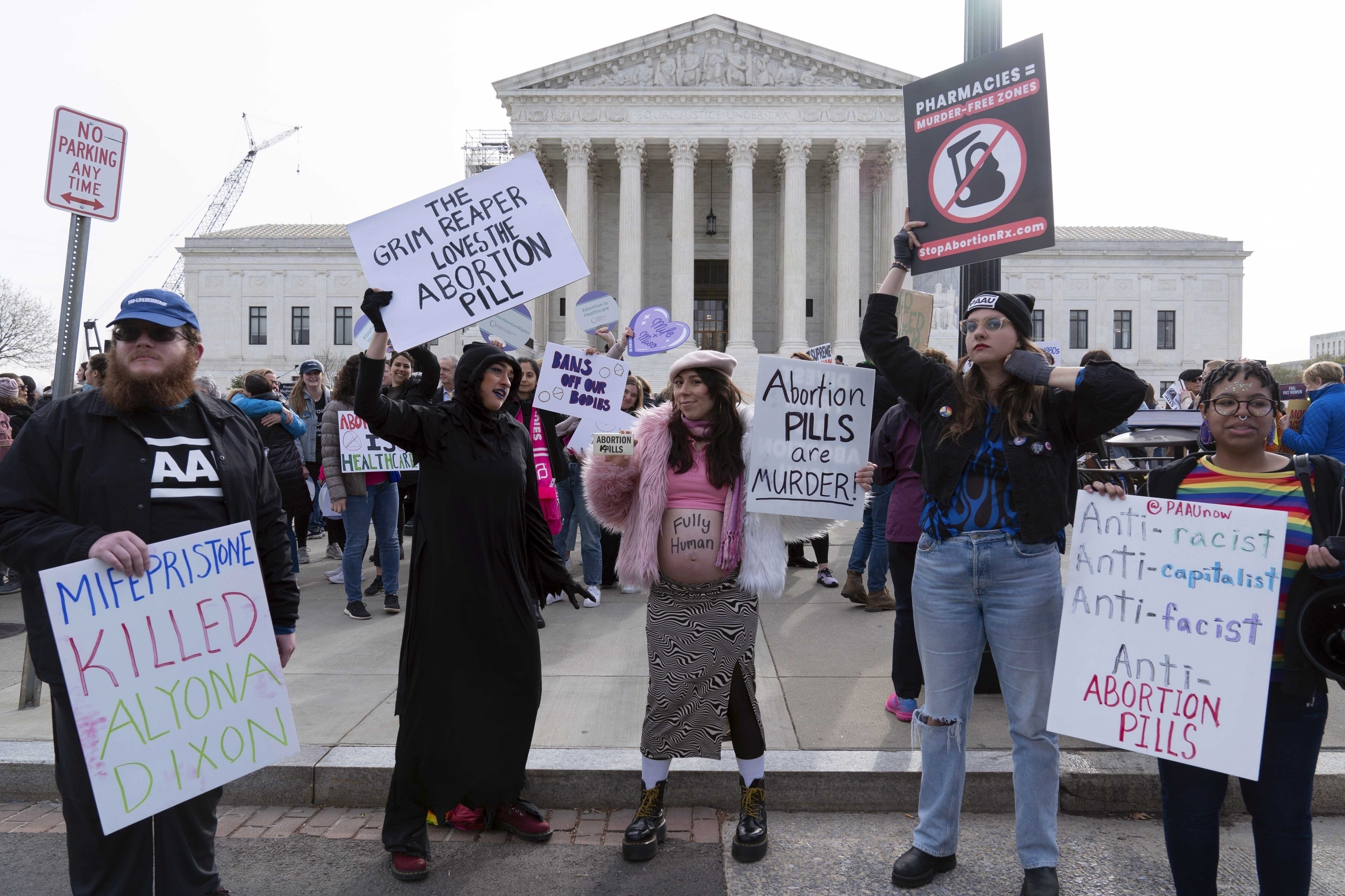 FILE - Anti-abortion demonstrators protest outside of the Supreme Court during a rally on March 26, 2024, in Washington. (AP Photo/Jose Luis Magana, File)