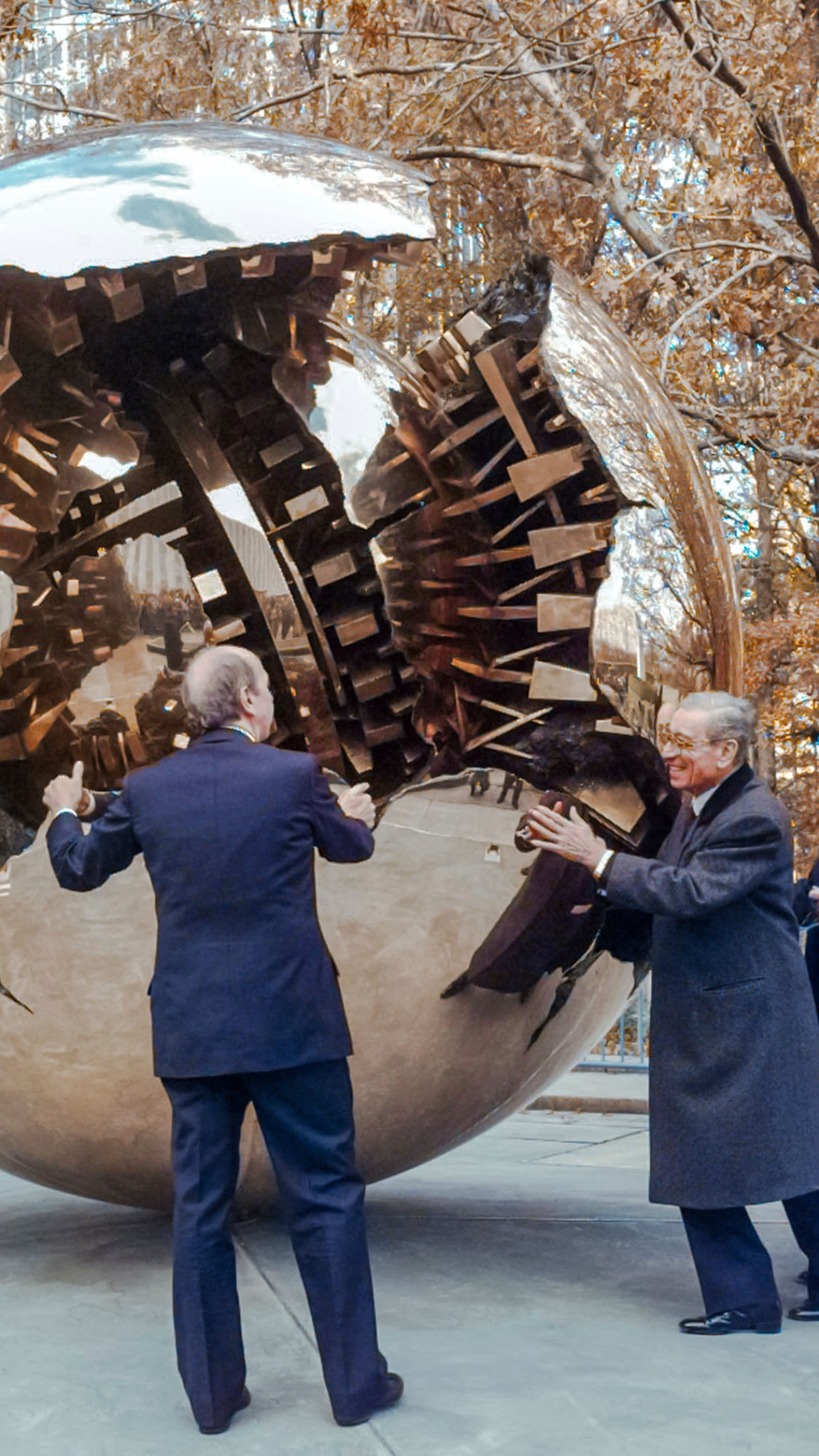FILE-- Boutros Boutros-Ghali, center, secretary general of the United Nations, gives a push to Italian sculptor Arnaldo Pomodoro's, right, "Sphere Within a Sphere" during its unveiling at the United Nations, Thursday, Nov. 21, 1996. Helping him to rotate the 8-ton bronze sculpture is Italy's Foreign Minister Umberto Dini, left. (AP Photo/Mark Lennihan)