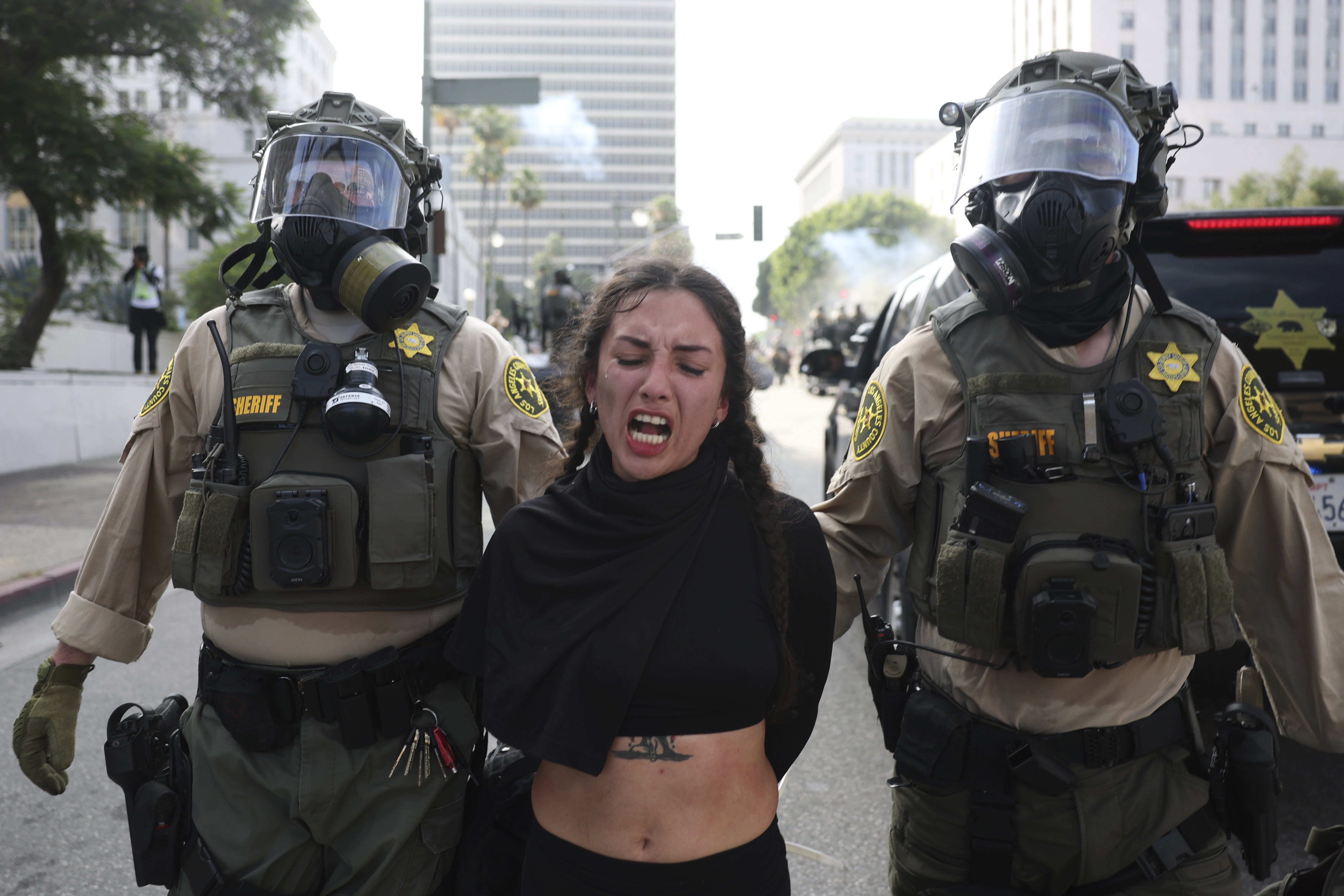 Los Angeles County Sheriffs arrest a demonstrator during a protest Saturday, June 14, 2025, in Los Angeles. (AP Photo/Ethan Swope)