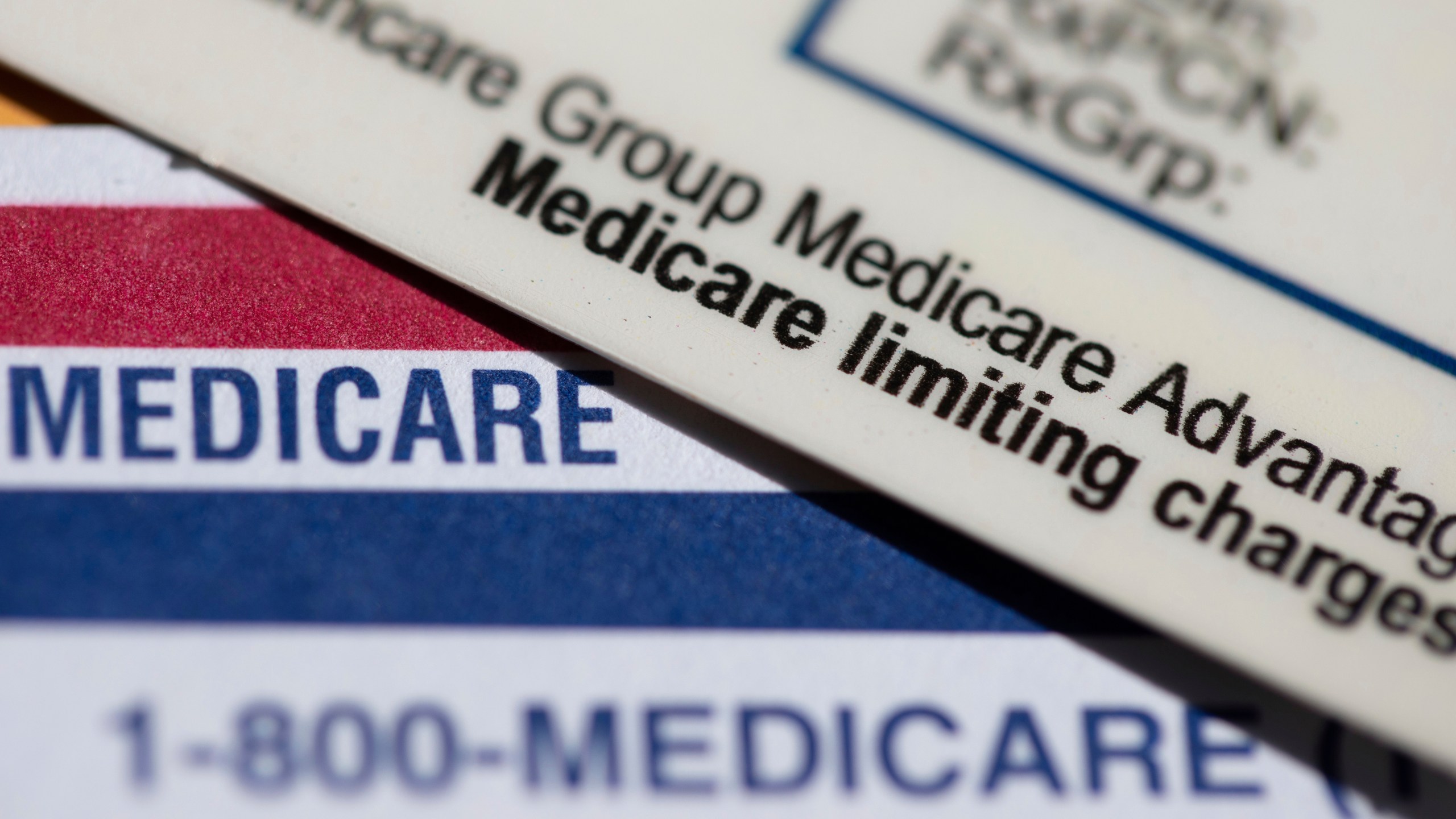 FILE - A Medicare Advantage PPO card rests on top of a Medicare card in Portland, Ore., June 10, 2024. (AP Photo/Jenny Kane, File)