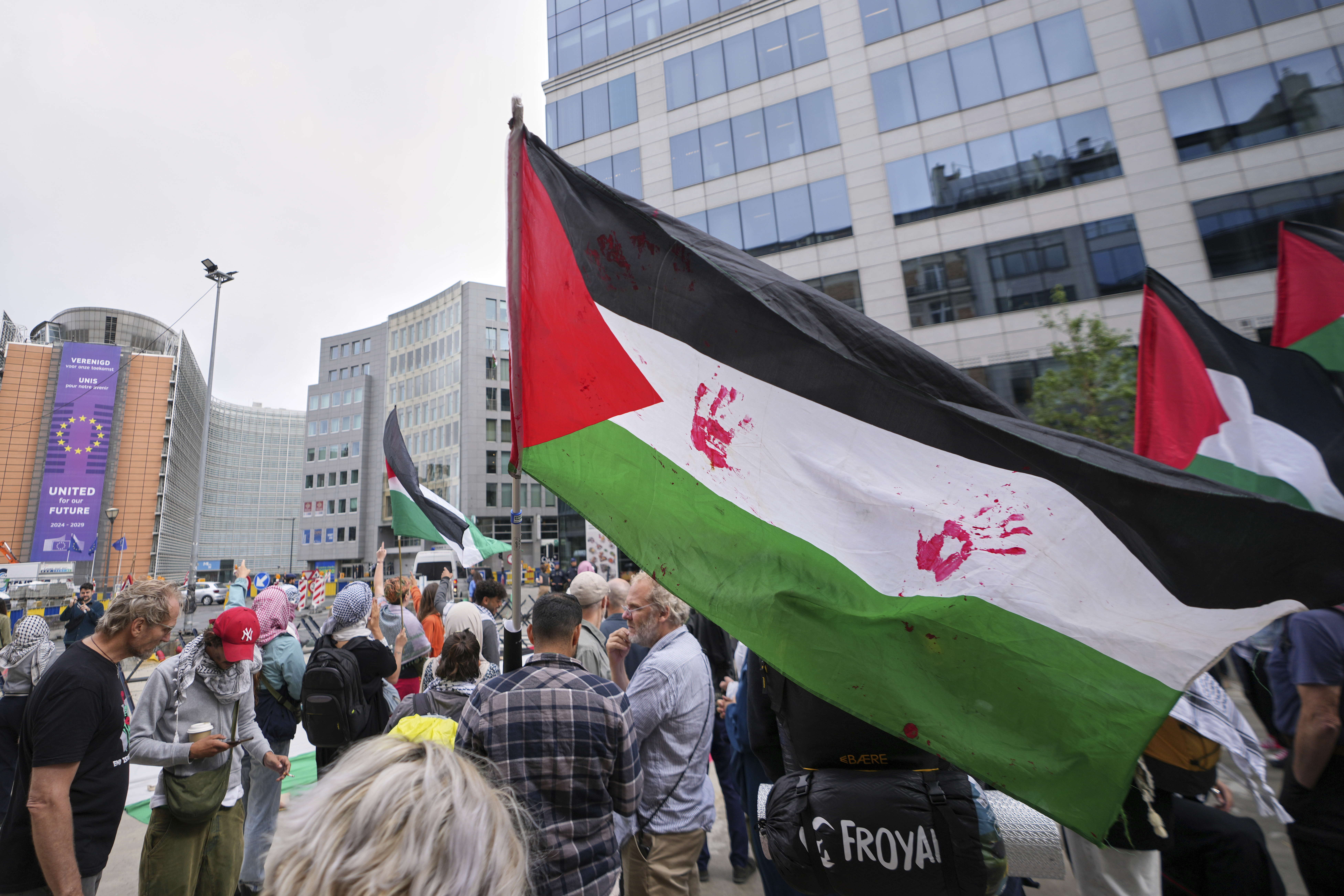 People attend a protest in support of Palestinians outside a meeting of EU foreign ministers at the European Council building in Brussels, Monday, June 23, 2025. (AP Photo/Virginia Mayo)