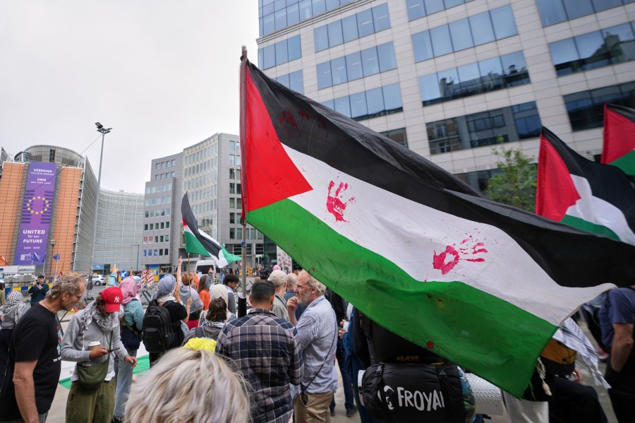 People attend a protest in support of Palestinians outside a meeting of EU foreign ministers at the European Council building in Brussels, Monday, June 23, 2025. (AP Photo/Virginia Mayo)