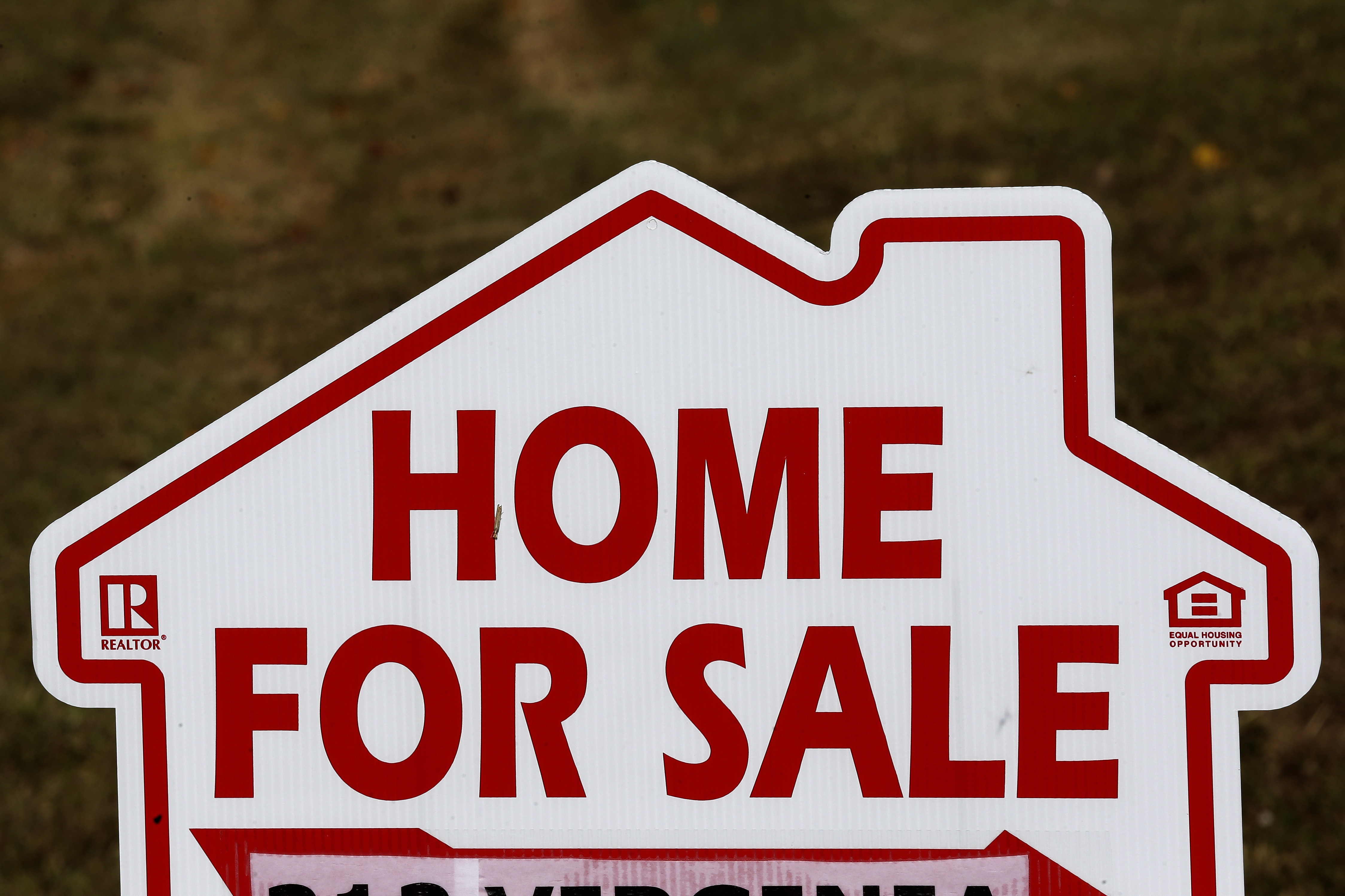 FILE - A sign advertising a home for sale is seen in Orange County near Hillsborough, N.C. Thursday, Oct. 17, 2019. (AP Photo/Gerry Broome, File)