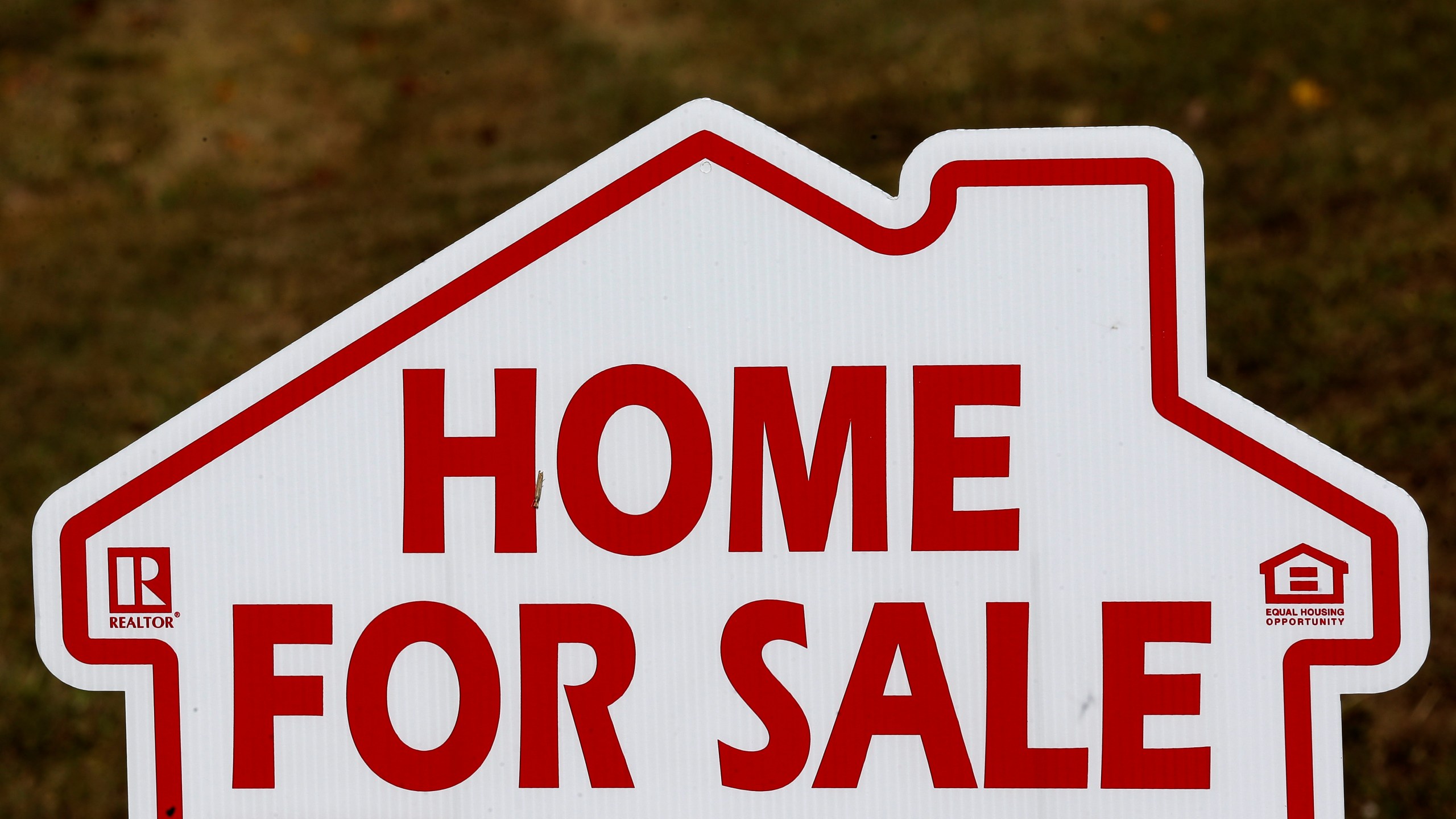 FILE - A sign advertising a home for sale is seen in Orange County near Hillsborough, N.C. Thursday, Oct. 17, 2019. (AP Photo/Gerry Broome, File)