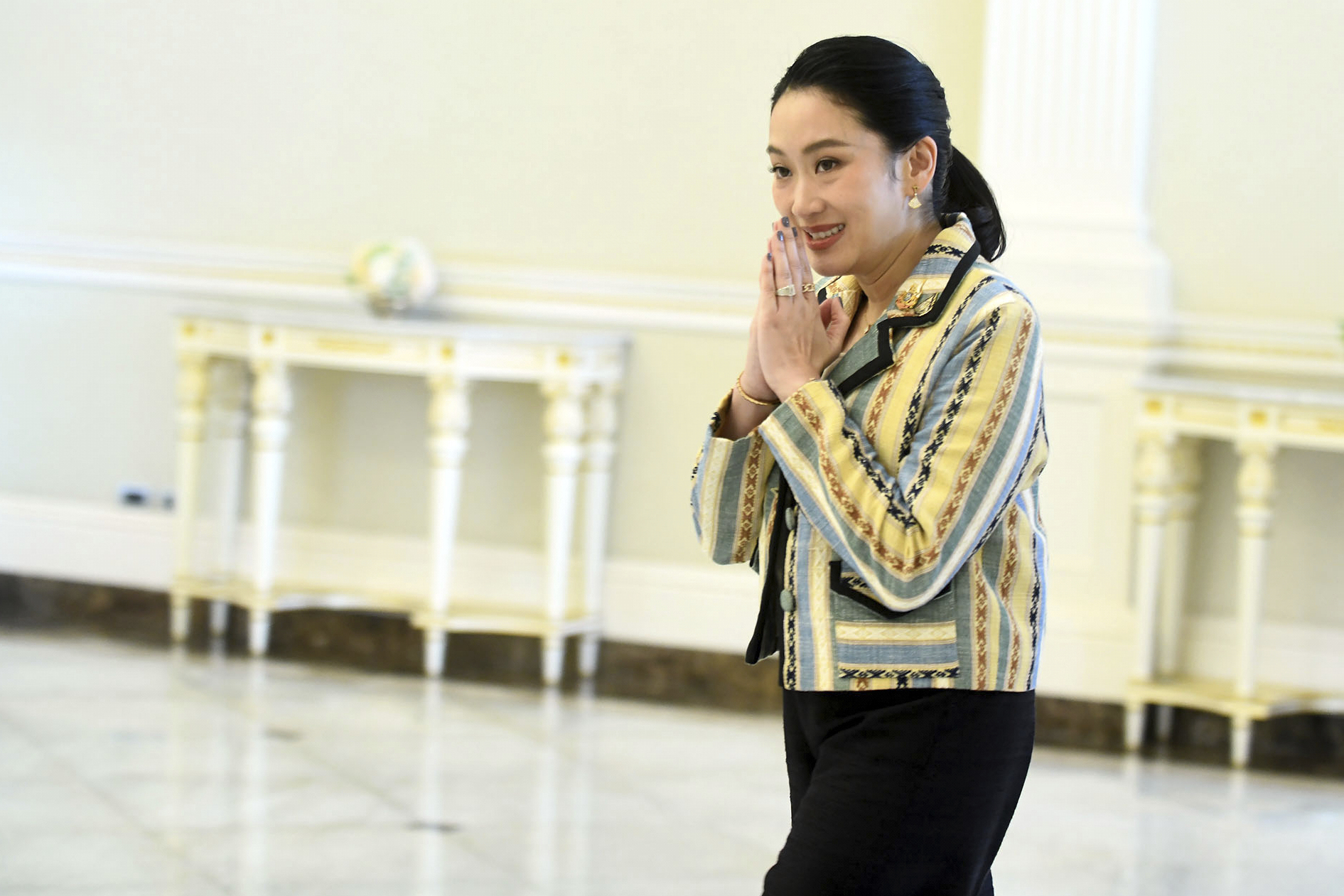 In this photo released by Thailand's Government Spokesman Office, Thailand's Prime Minister Paetongtarn Shinawatra arrives at Government house in Bangkok, Thailand, Monday, June 23, 2025. (Thailand's Government Spokesman Office via AP)