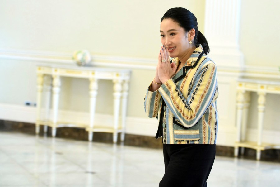 In this photo released by Thailand's Government Spokesman Office, Thailand's Prime Minister Paetongtarn Shinawatra arrives at Government house in Bangkok, Thailand, Monday, June 23, 2025. (Thailand's Government Spokesman Office via AP)