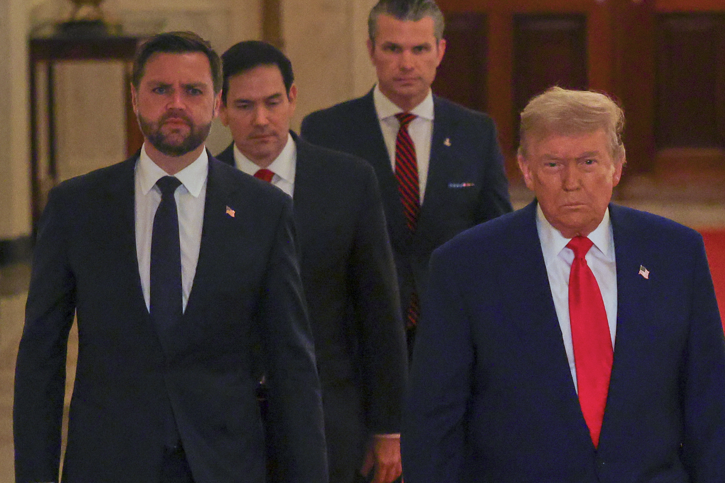 President Donald Trump arrives with Vice President JD Vance, Secretary of State Marco Rubio and Defense Secretary Pete Hegseth to speak from the East Room of the White House in Washington, Saturday, June 21, 2025, after the U.S. military struck three Iranian nuclear and military sites, directly joining Israel's effort to decapitate the country's nuclear program. (Carlos Barria/Pool via AP)