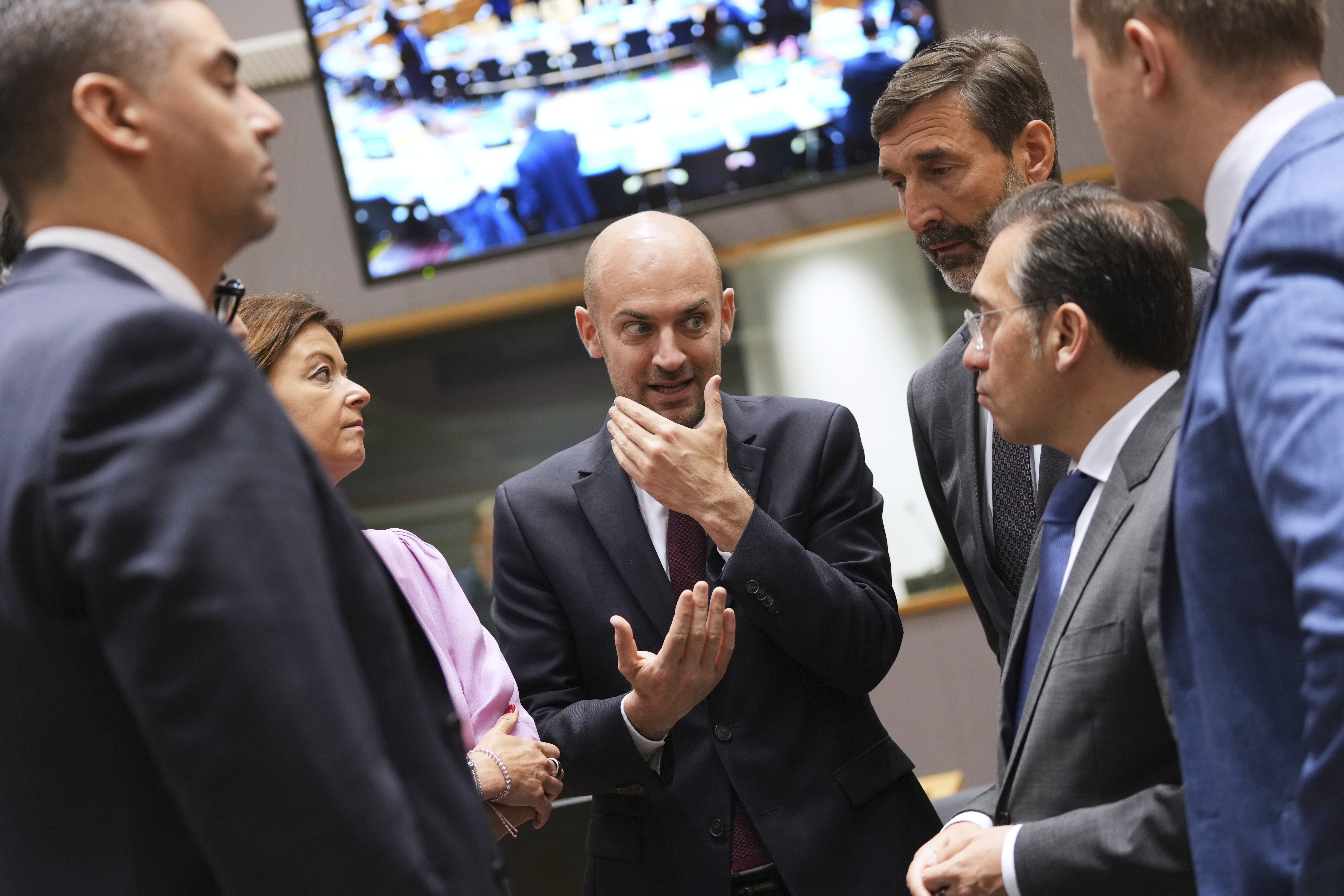 French Foreign Minister Jean-Noel Barrot, center, speaks with from left, Malta's Foreign Minister Ian Borg, Slovenia's Foreign Minister Tanja Fajon, Slovakia's Foreign Minister Juraj Blanar and Spain's Foreign Minister Jose Manuel Albares Bueno during a meeting of EU foreign ministers at the European Council building in Brussels, Monday, June 23, 2025. (AP Photo/Virginia Mayo)
