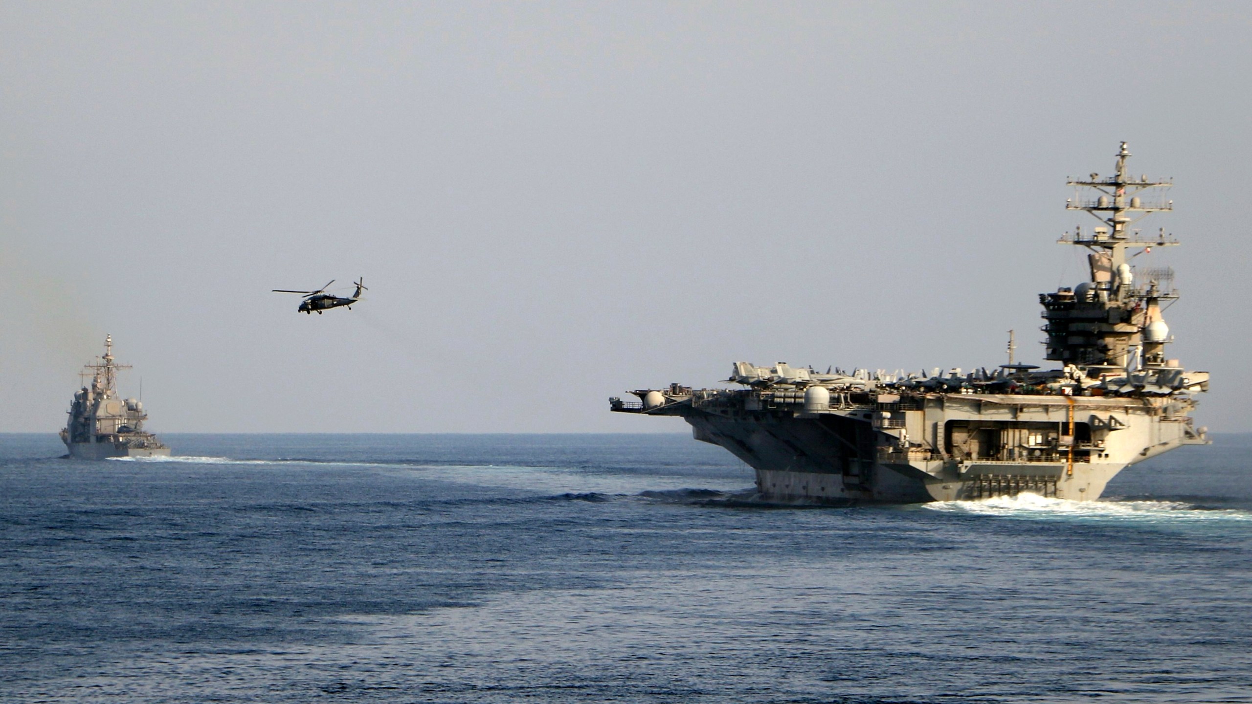 FILE - The aircraft carrier USS Dwight D. Eisenhower and other warships crosses the Strait of Hormuz into the Persian Gulf on Sunday, Nov. 26, 2023. (Information Technician Second Class Ruskin Naval/U.S. Navy via AP, file)