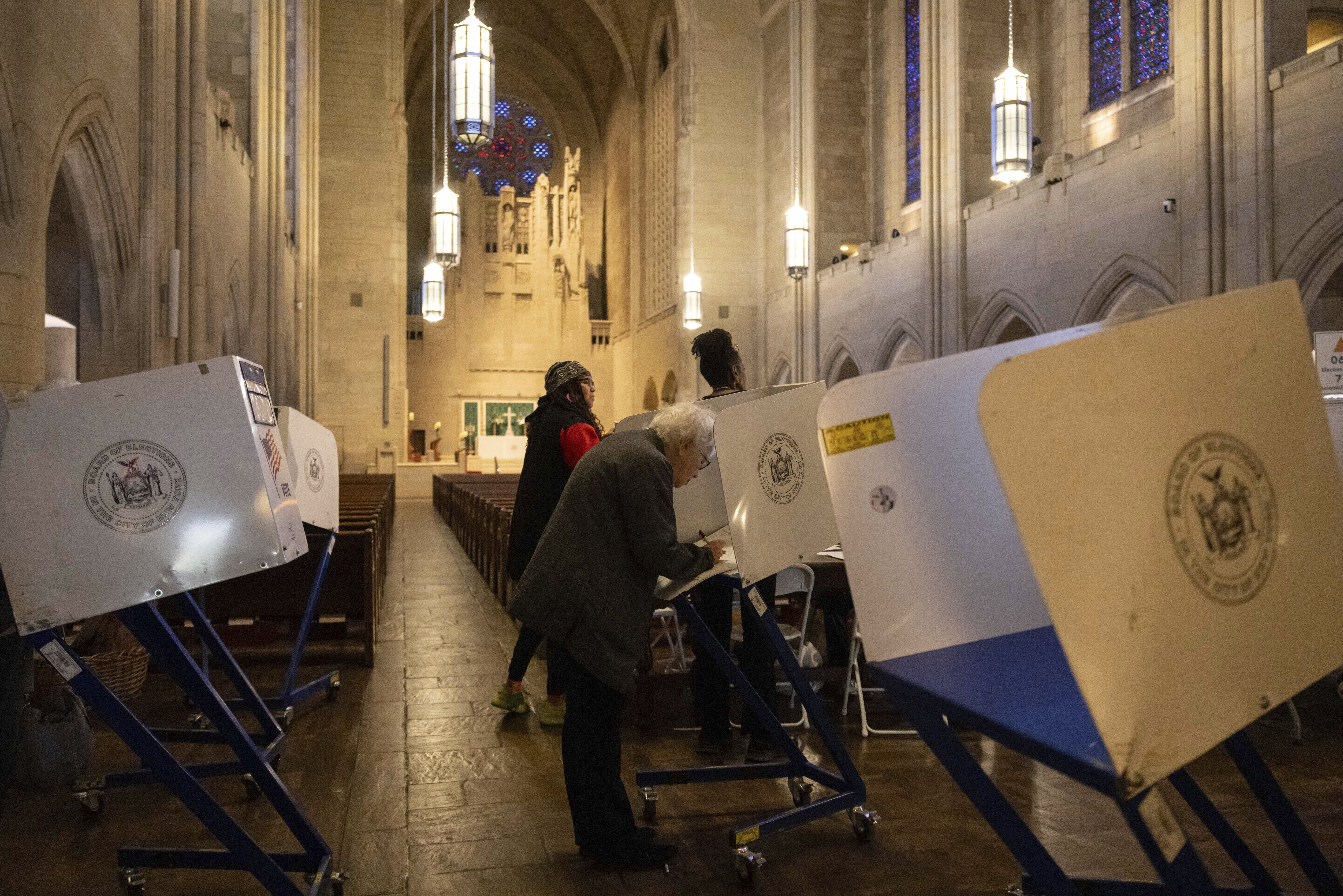 FILE - A voter casts a ballot at the Church of the Heavenly Rest in New York on Election Day, Tuesday, Nov. 5, 2024. (AP Photo/Yuki Iwamura, File)