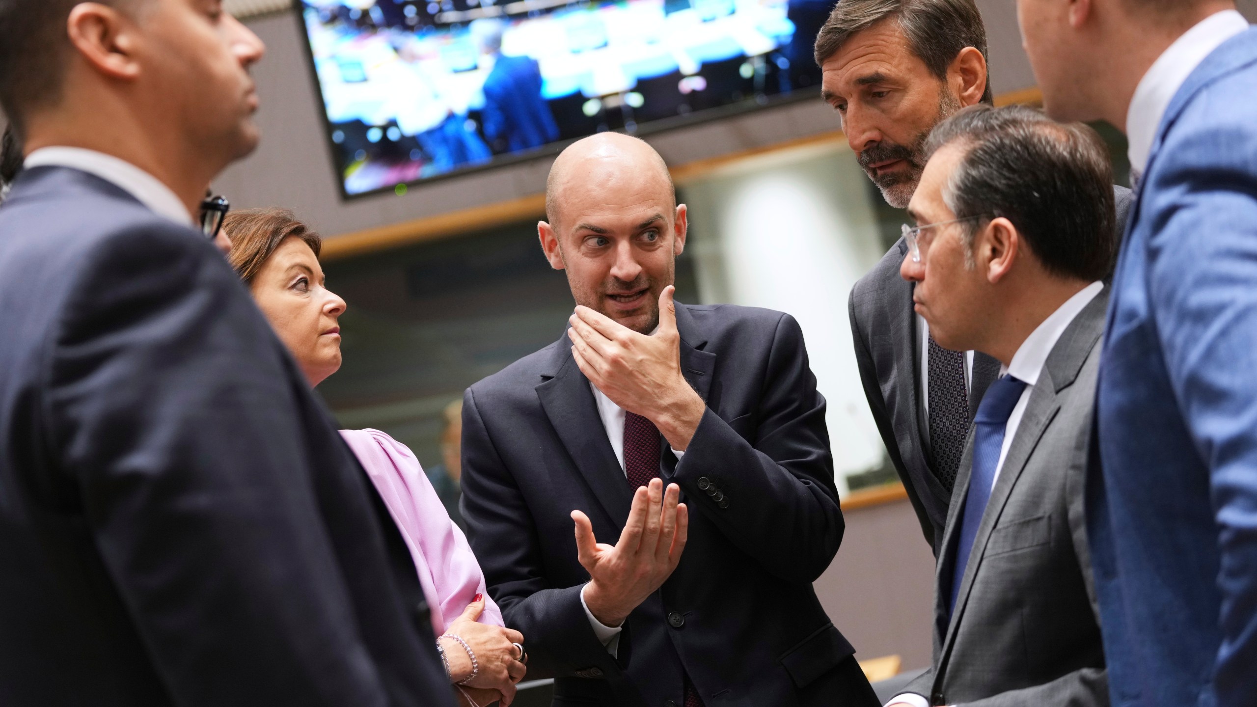 French Foreign Minister Jean-Noel Barrot, center, speaks with from left, Malta's Foreign Minister Ian Borg, Slovenia's Foreign Minister Tanja Fajon, Slovakia's Foreign Minister Juraj Blanar and Spain's Foreign Minister Jose Manuel Albares Bueno during a meeting of EU foreign ministers at the European Council building in Brussels, Monday, June 23, 2025. (AP Photo/Virginia Mayo)
