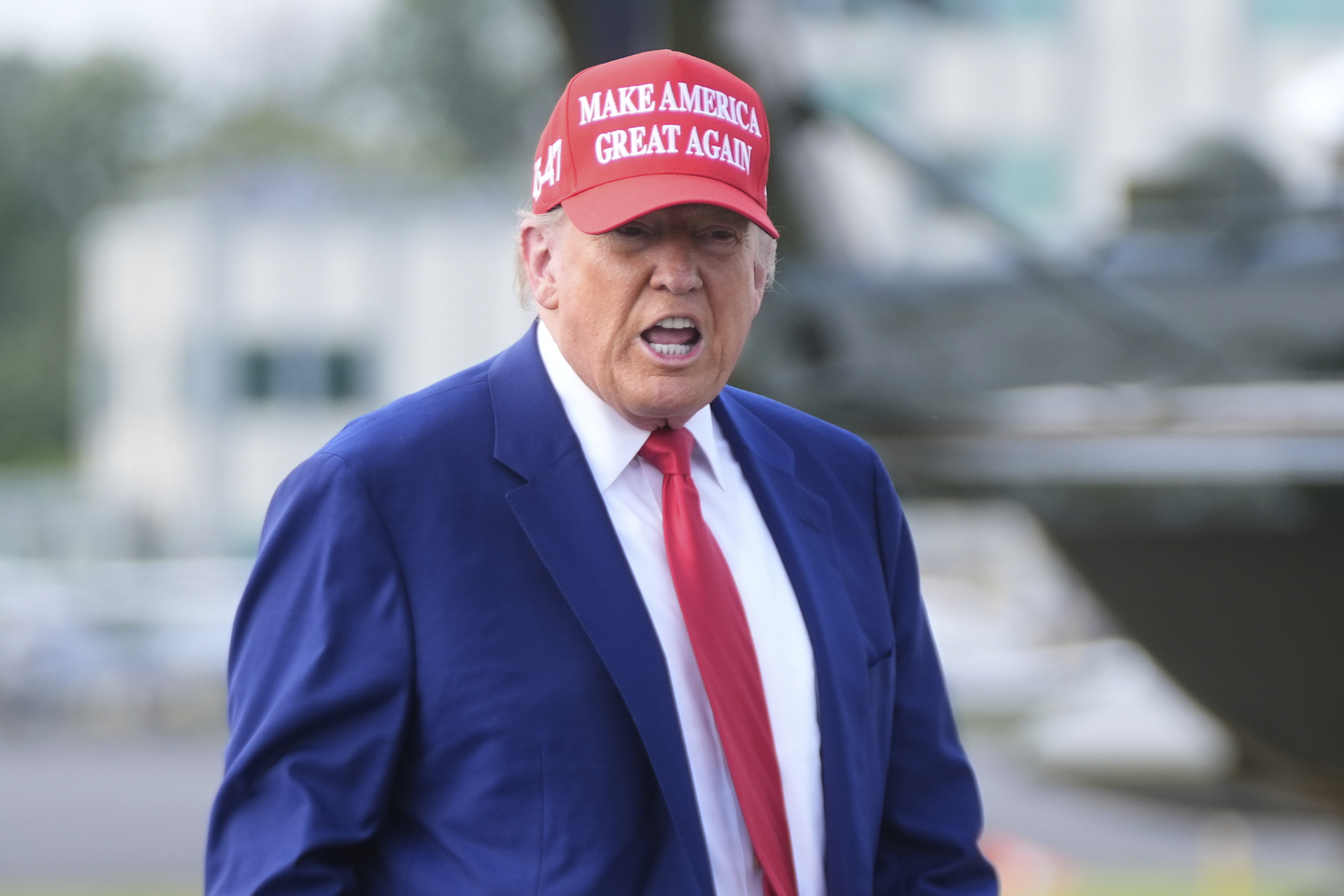 President Donald Trump boards Air Force One at Morristown Municipal Airport in Morristown, N.J., Saturday, June 21, 2025. (AP Photo/Manuel Balce Ceneta)